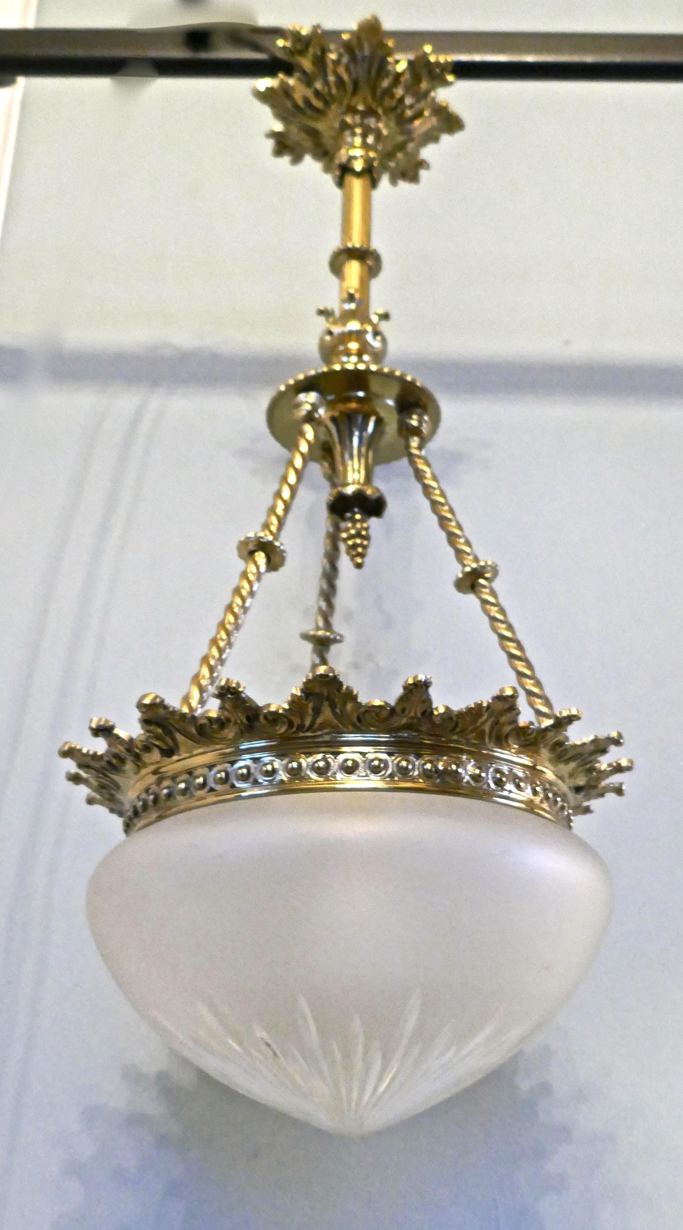 Beautiful large early 20th century Empire style bowl chandelier

This is a stunning piece, it has an bright brass frame, at the top there is an elaborated ceiling rose decorated with leaves, down through the centre there is a corinthian style