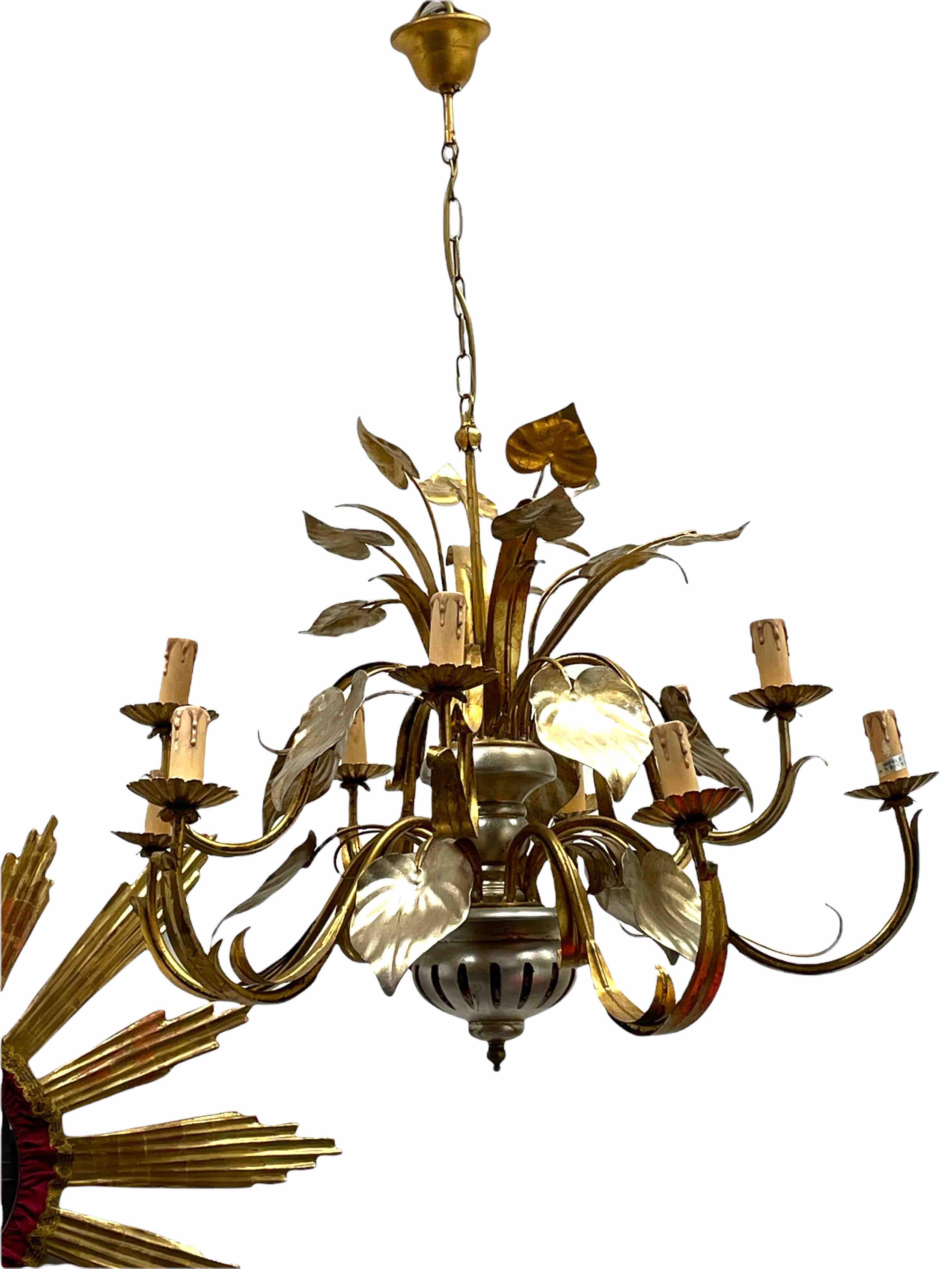 Add a touch of opulence to your home with this charming chandelier! Perfect gilt and silvered Metal and wood to enhance any chic or eclectic home. We'd love to see it hanging in an entry hall or in a Living / Dinning room area. Built in the 1960s,