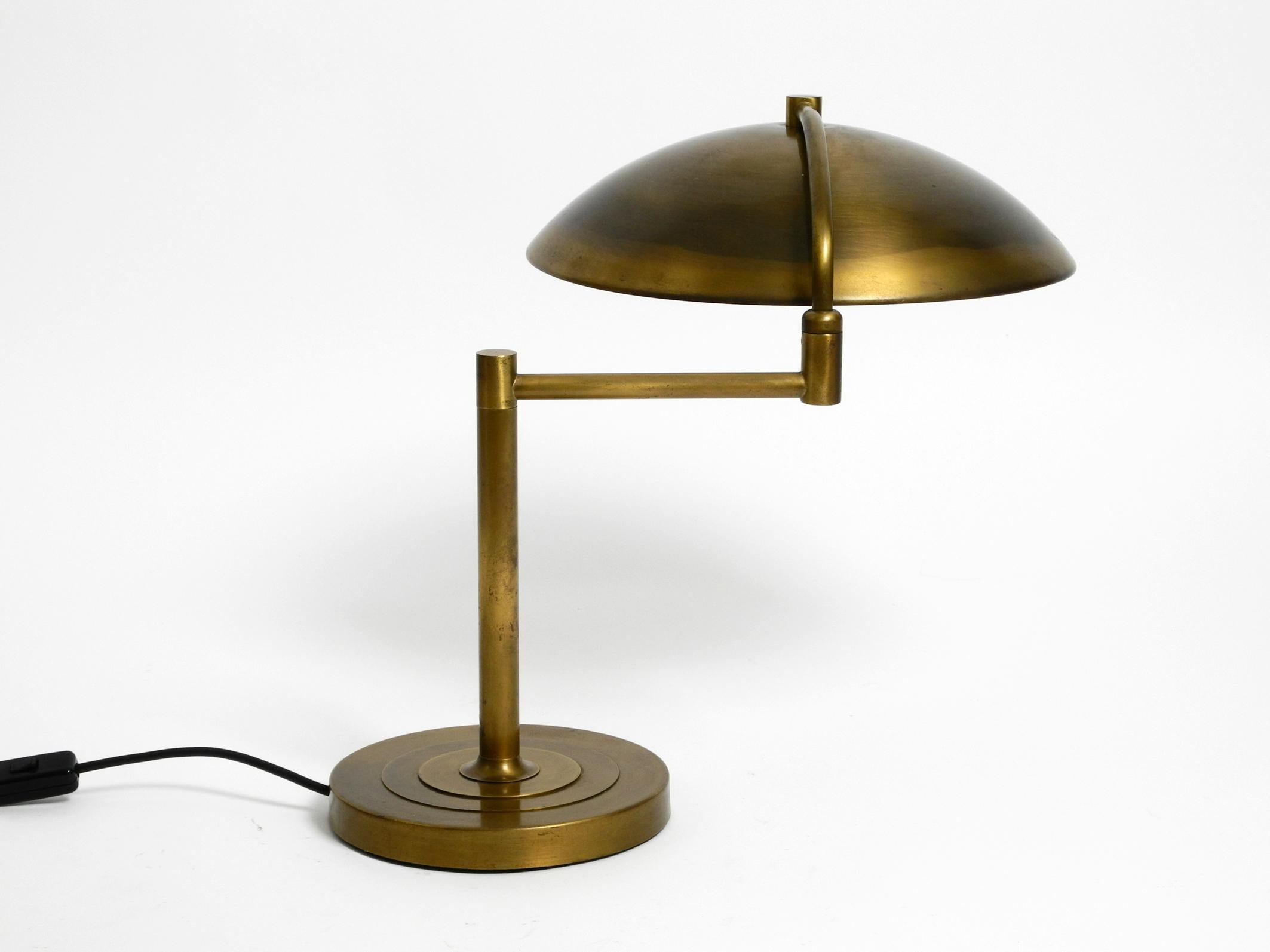 Beautiful large heavy Mid Century Modern brass table lamp with swivel joint.
Great minimalist elegant design. Made in Germany.
In very good condition with very few signs of wear.
Lamp is made entirely of brass. Has something of an Art Deco
