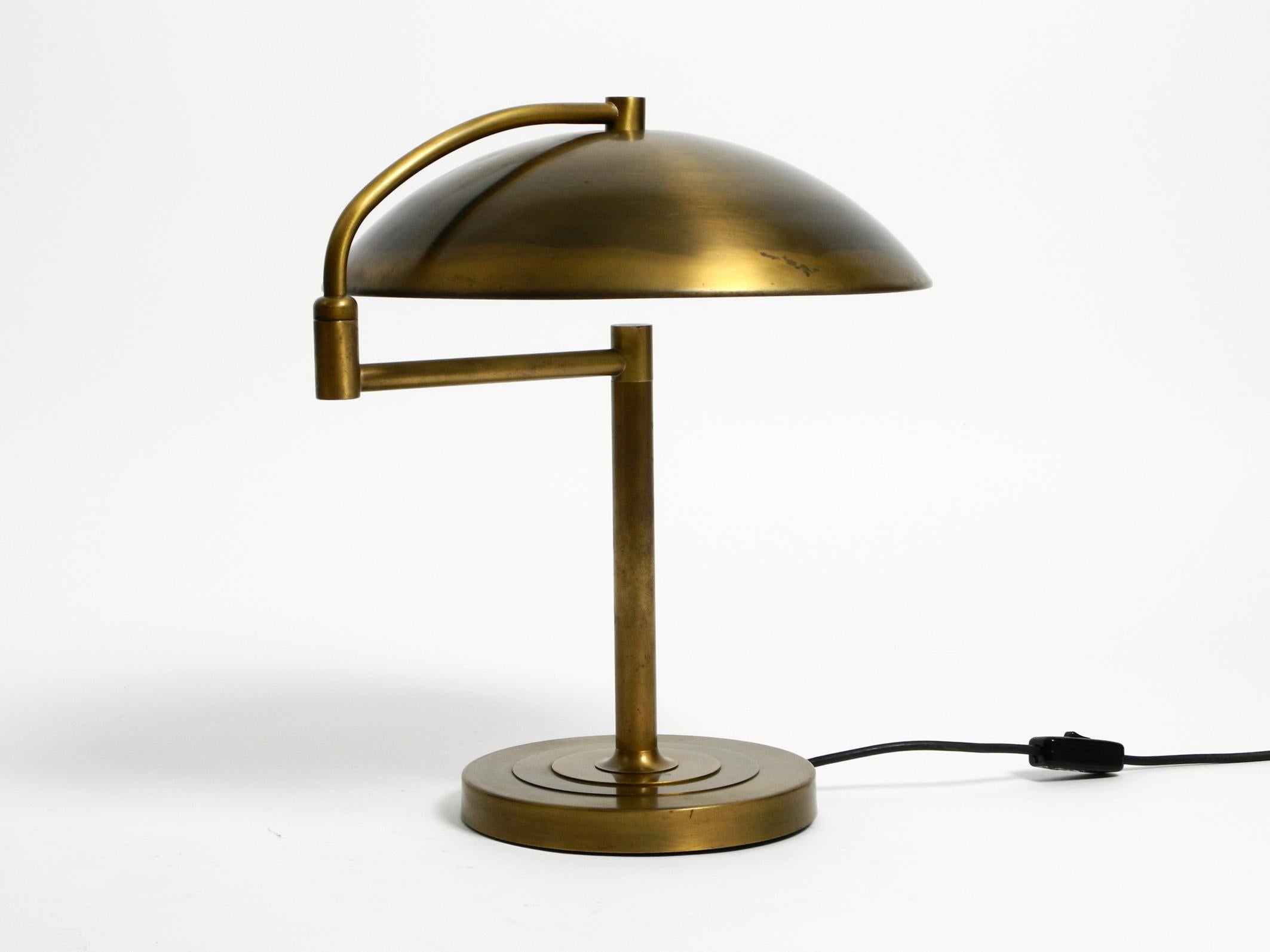 German Beautiful large heavy Mid Century Modern brass table lamp with swivel joint For Sale