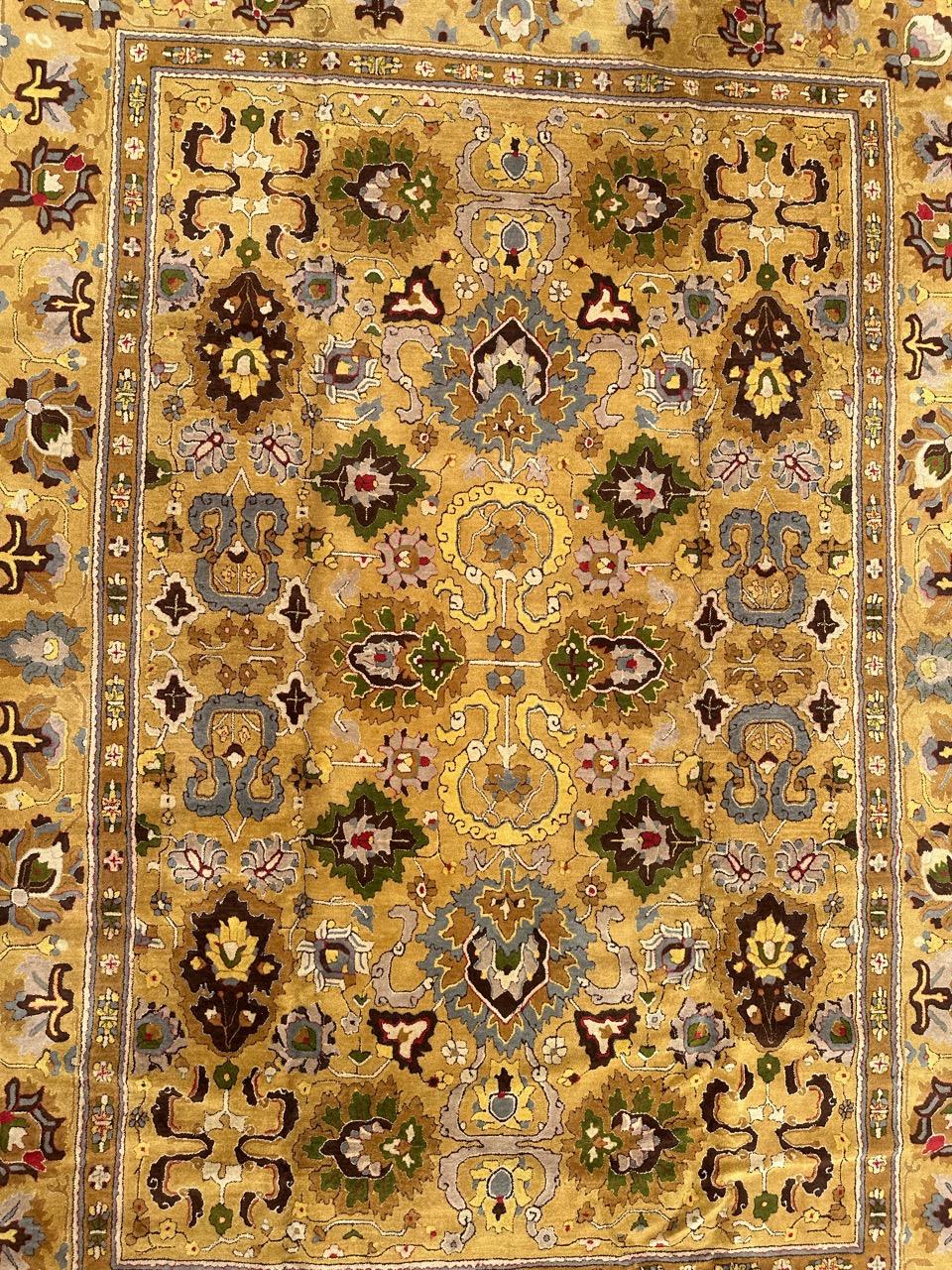 Nice midcentury French Janus rug made in point de Janus or Lys manufacturing looms, very decorative with beautiful Agra design and nice colors with mustard yellow background ,  blue, green, purple, yellow, pink, red and white. Entirely handmade with