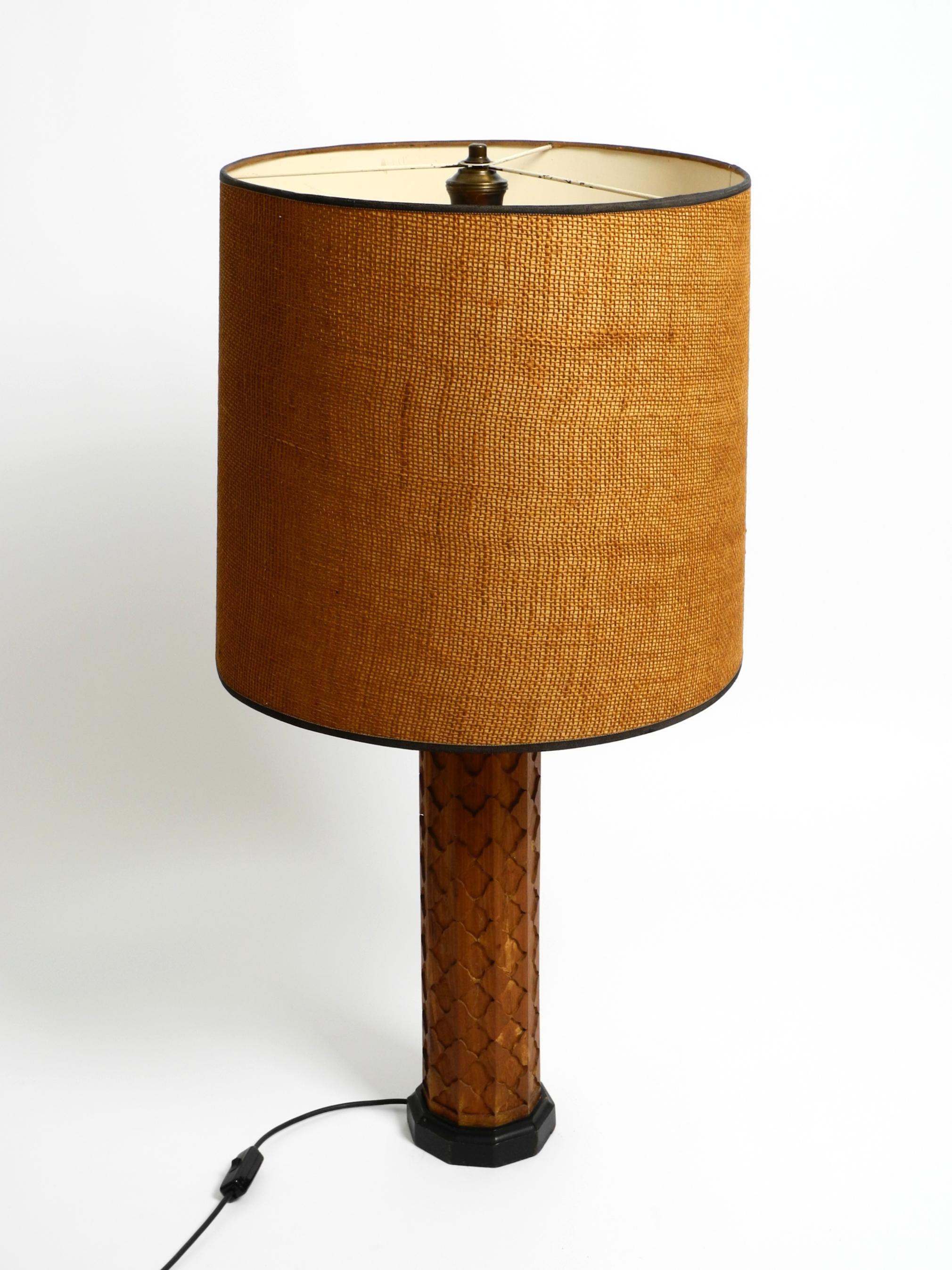 Beautiful, large mid-century modern table lamp made of ornate wood.
Made in Germany. Great design with a stunning patina.
In good, original vintage condition. After 70 years, the wood has a natural patina, including fine cracks, discoloration, and