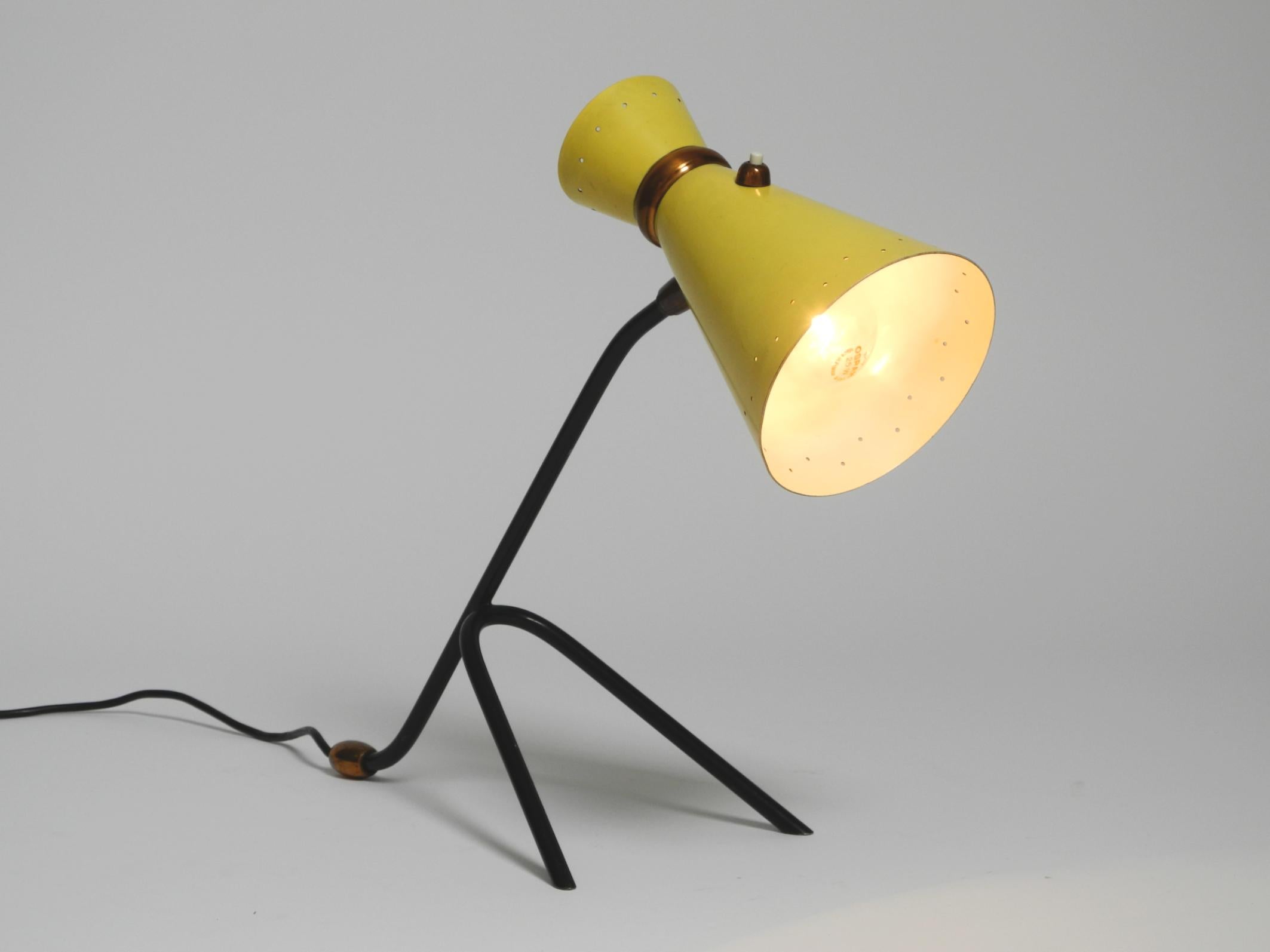 German Beautiful large Mid Century tripod table lamp with yellow diabolo lampshade For Sale