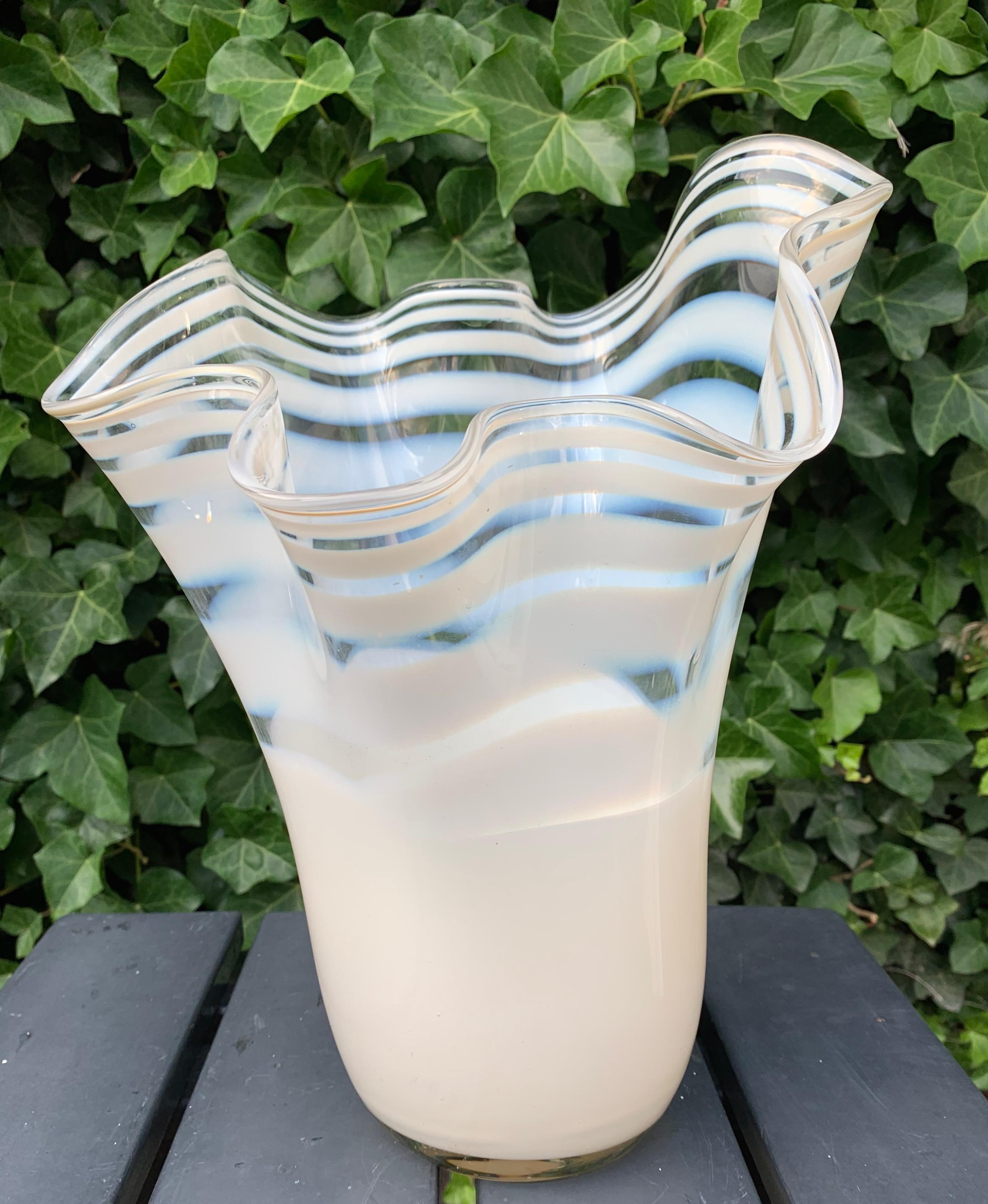 A playful and organically beautiful, mouthblown, glass vase.

This large and elegant Murano vase from the 1970s is a truly exquisite vase and she is in very good, original condition. If you are looking for a vase to bring some extra light into