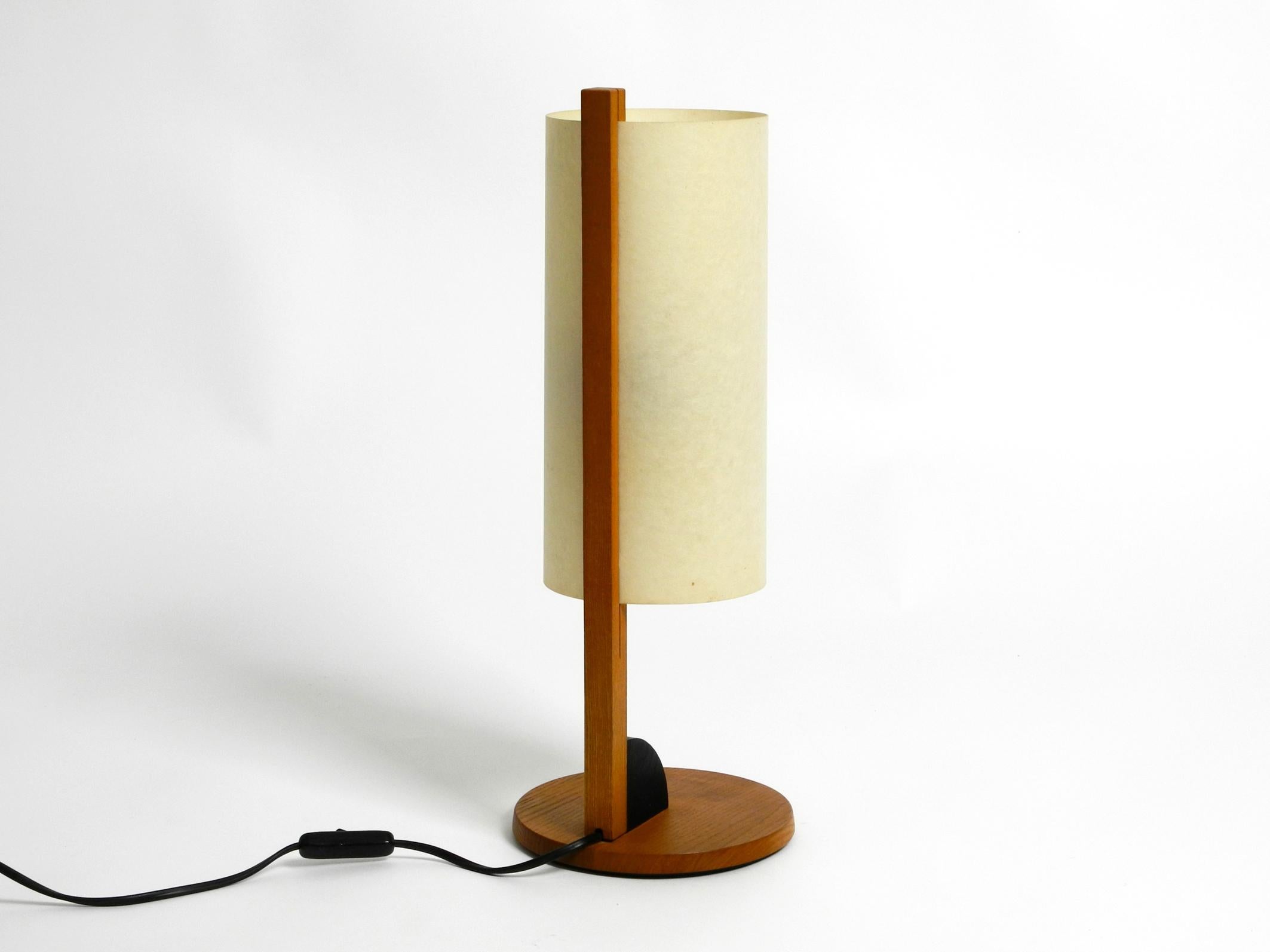Beautiful large teak table lamp with Lunopal lampshade. 
Great minimalist Postmodern design from the 1980s.
With original label on the frame. Type 7627. Made in Germany.
This table lamp by Domus is no longer produced.
The shade is made of