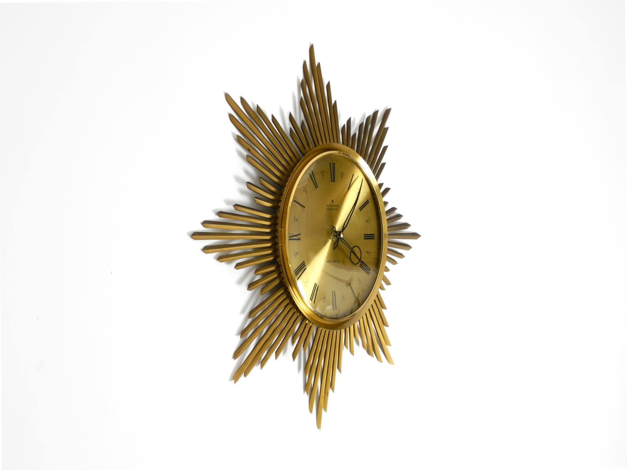 German Beautiful large original 1960s brass sunburst wall clock by Junghans ATO-MAT For Sale