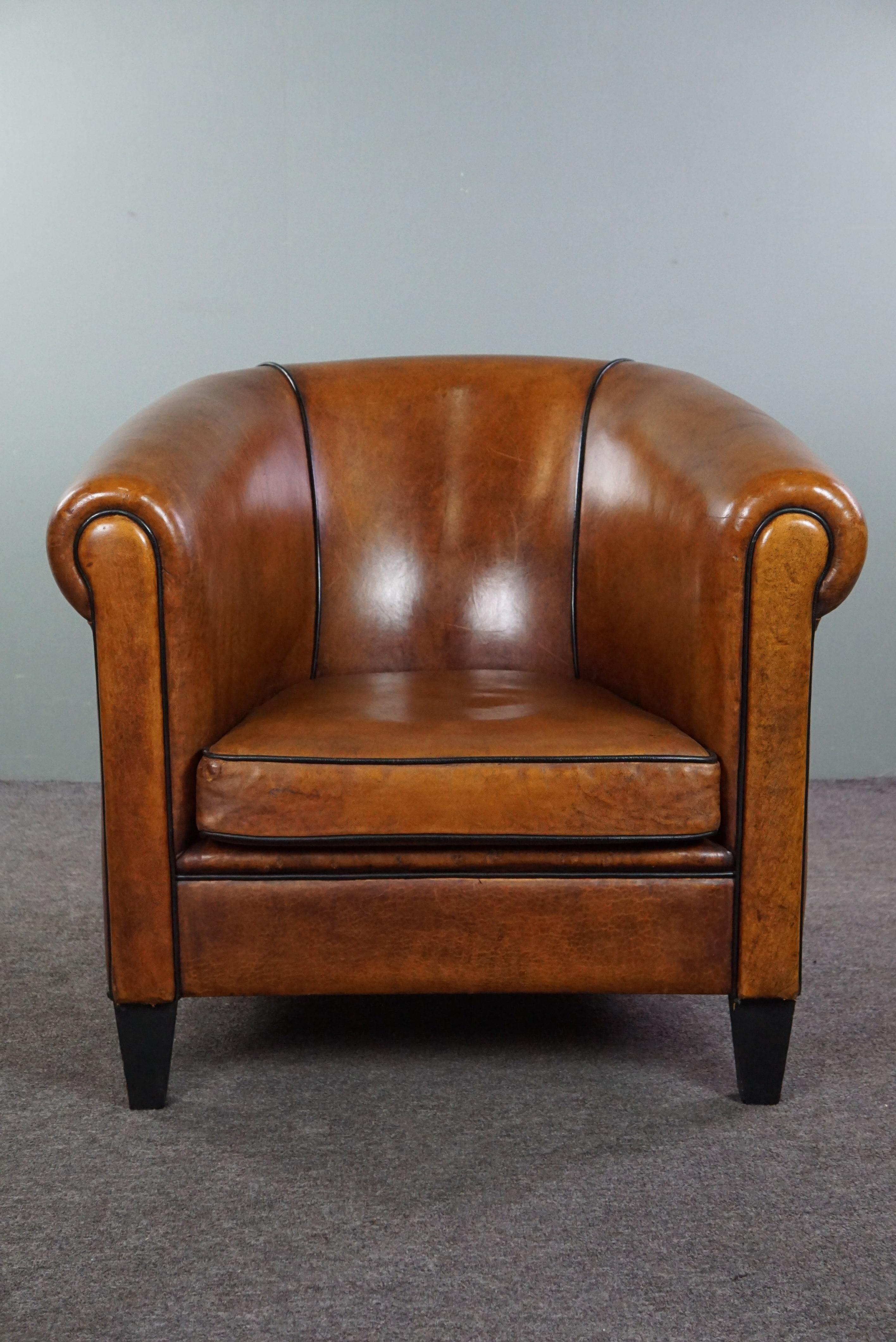 Dutch Beautiful large sheep leather club chair finished with black piping For Sale