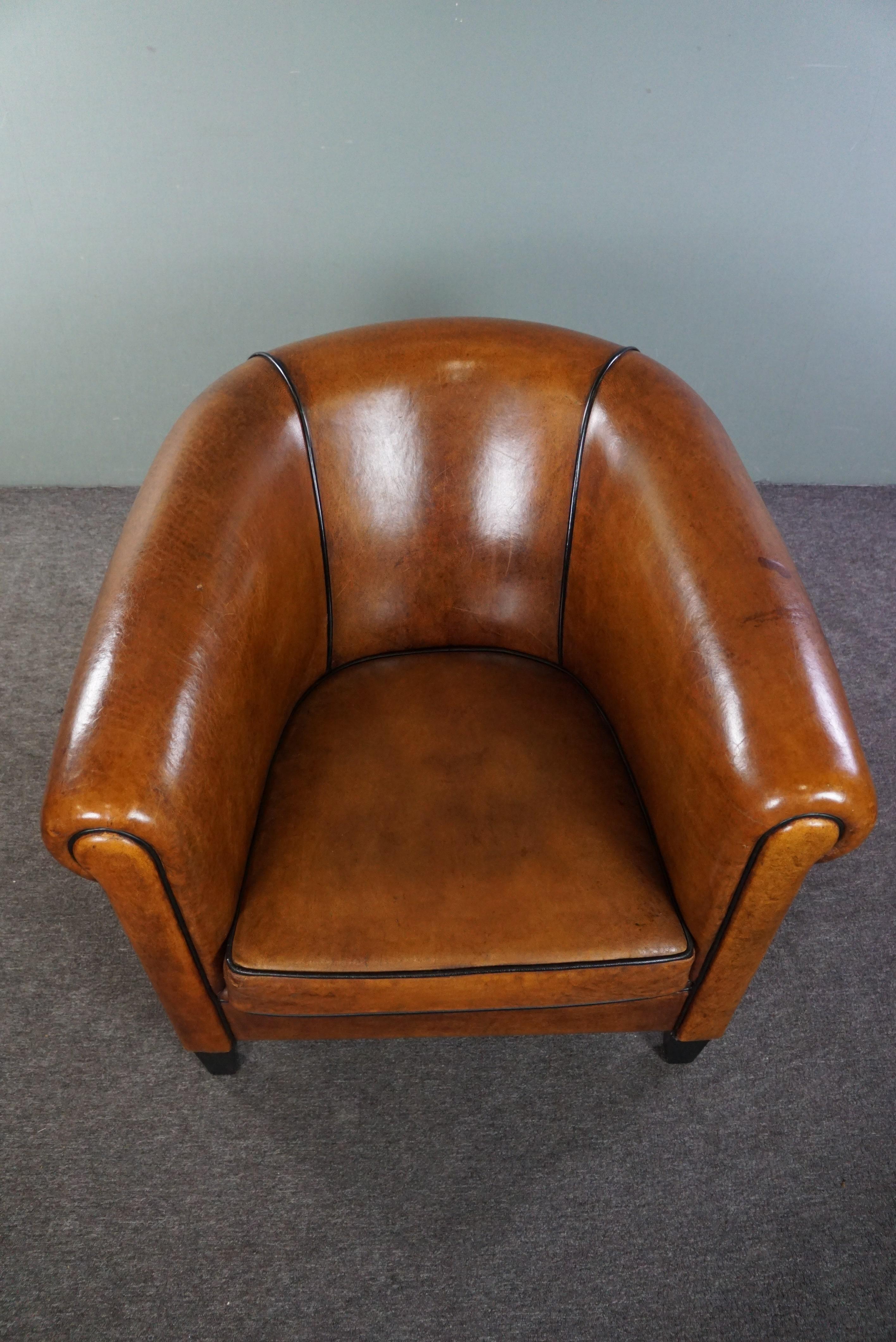 Leather Beautiful large sheep leather club chair finished with black piping For Sale