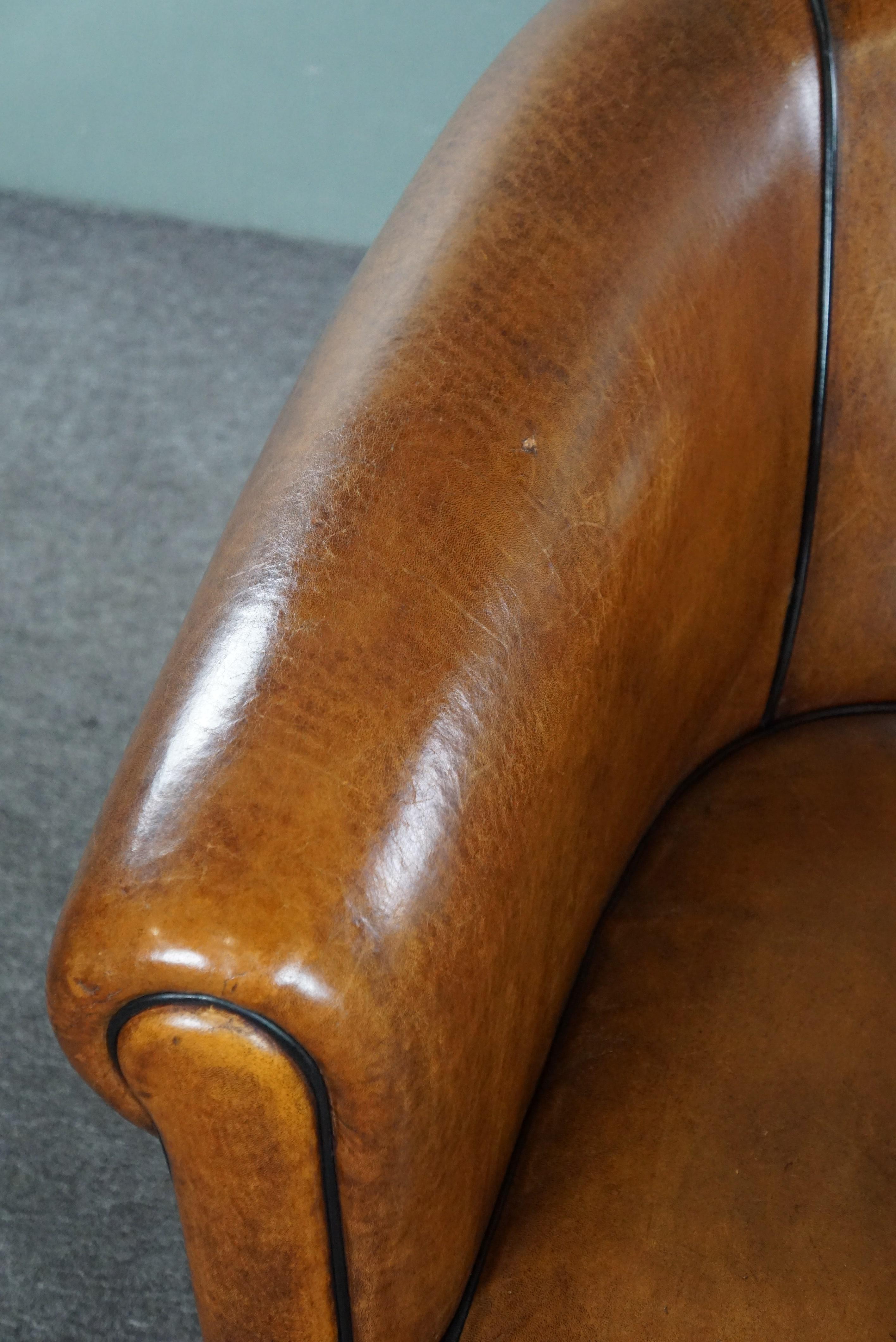 Beautiful large sheep leather club chair finished with black piping For Sale 1