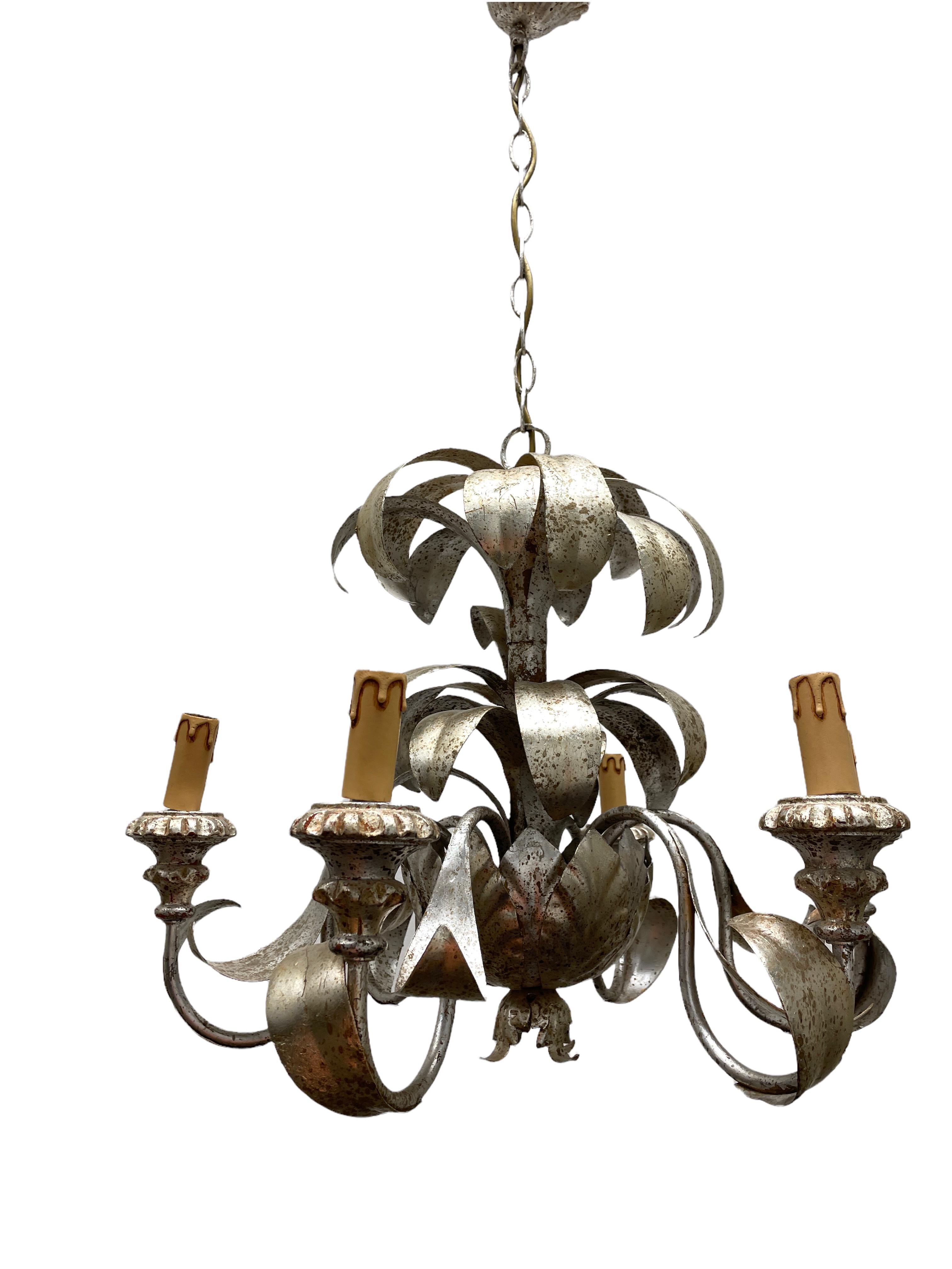 Add a touch of opulence to your home with this charming chandelier! Perfect silvered Metal to enhance any chic or eclectic home. We'd love to see it hanging in an entry hall or in a Living / Dinning room area. Built in the 1960s, attributed to