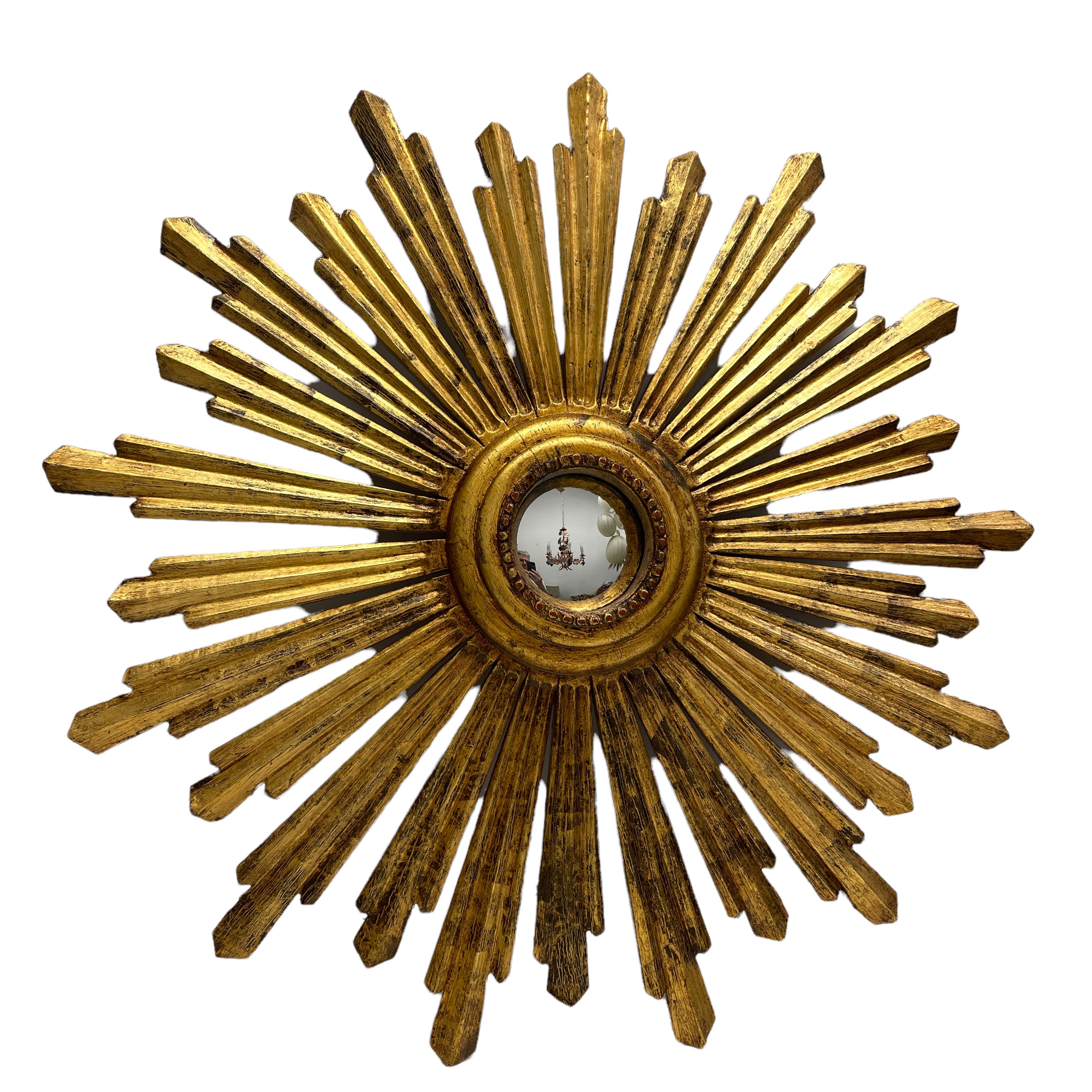 A beautiful starburst sunburst mirror. Made of gilded wood. It measures approximate 27