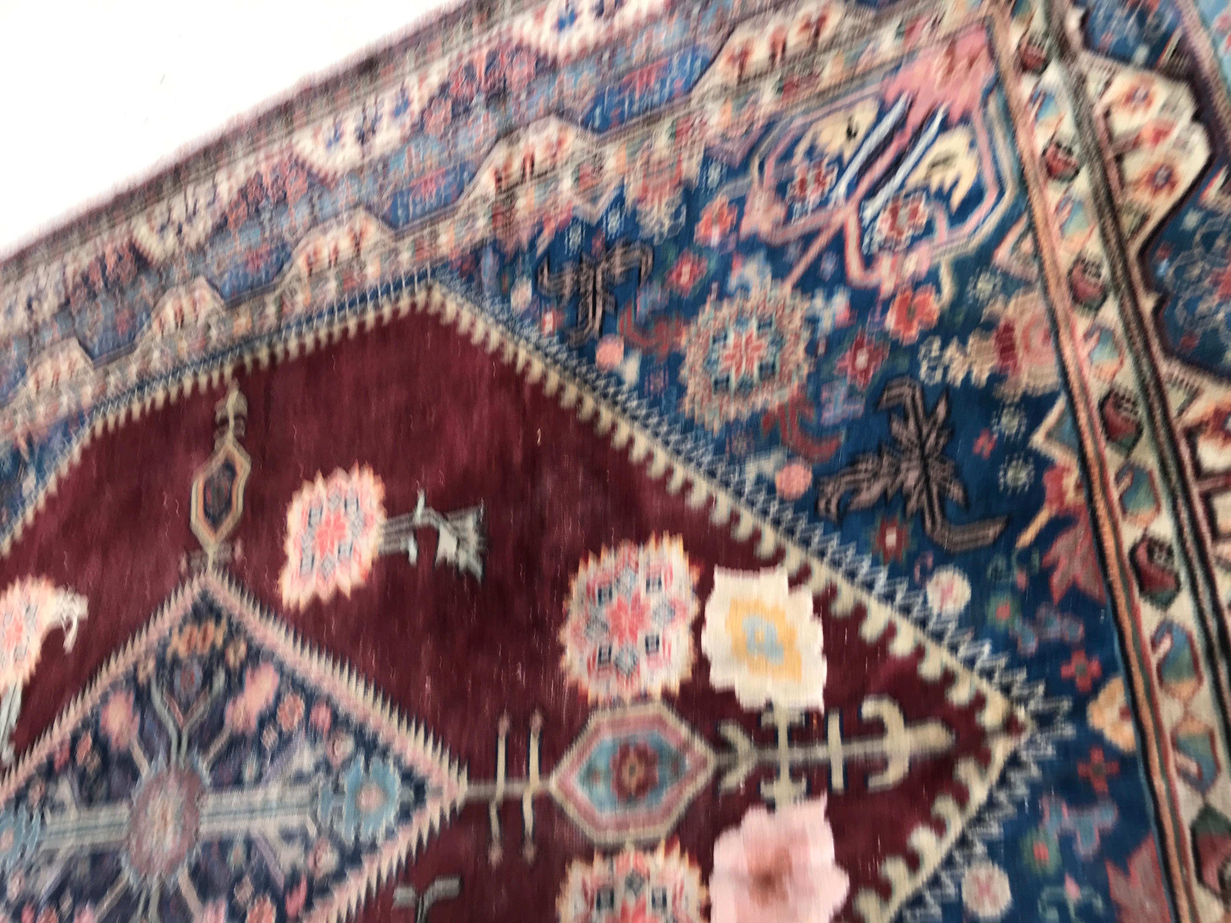 Nice large rug from China or Samarkand, mid-20th century, with a beautiful design and patterns, decorative carpet, and beautiful colors with purple, entirely hand knotted with wool velvet on cotton foundation.

             