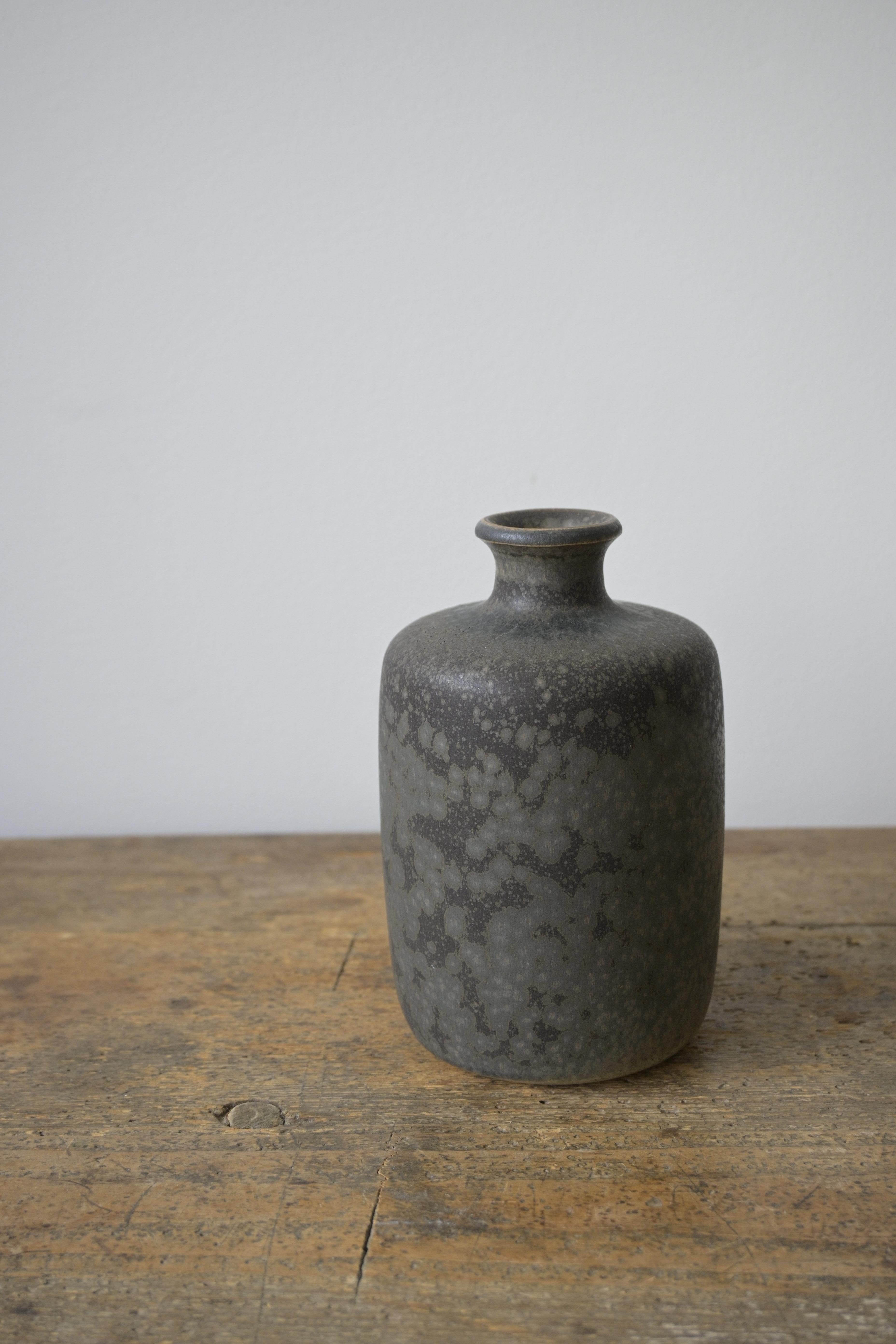 Beautiful Larger Swedish Vase by Rolf Palm, Sweden 1960s

A beautiful vase with a lovely multicolored glaze designed by Rolf Palm, made at his workshop in Mölle outside Höganäs in Sweden.

Rolf Palm was one of Swedens leading ceramicist of the 20th