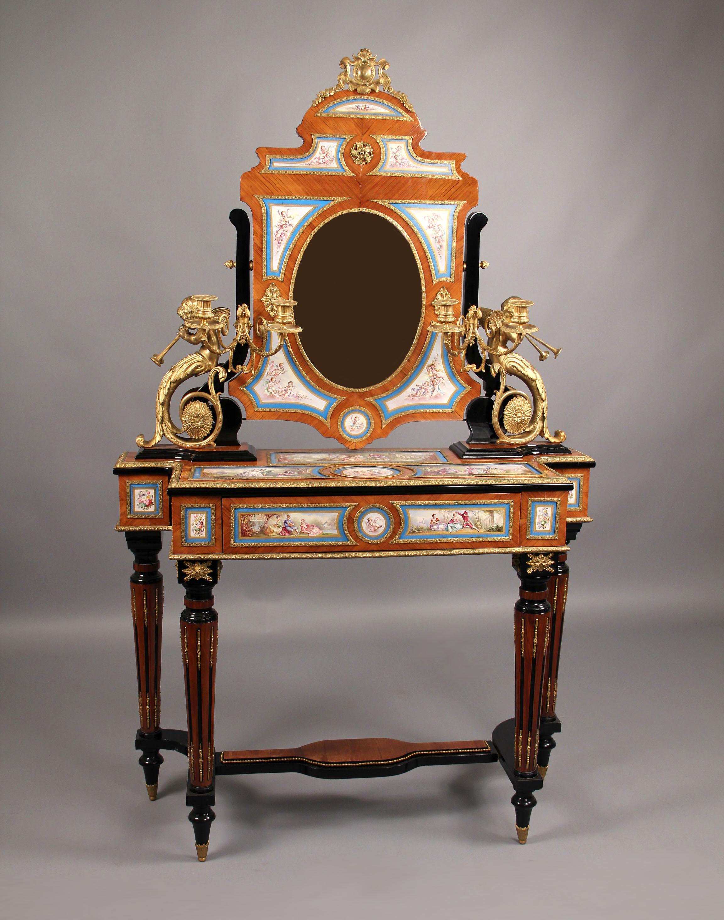 A beautiful late 19th century gilt bronze-mounted Louis XVI sèvres style dressing table.

This wonderful and rare table is mounted by over twenty three individual porcelain plaques depicting flowers, cherubs and landscape scenes with lovers. The