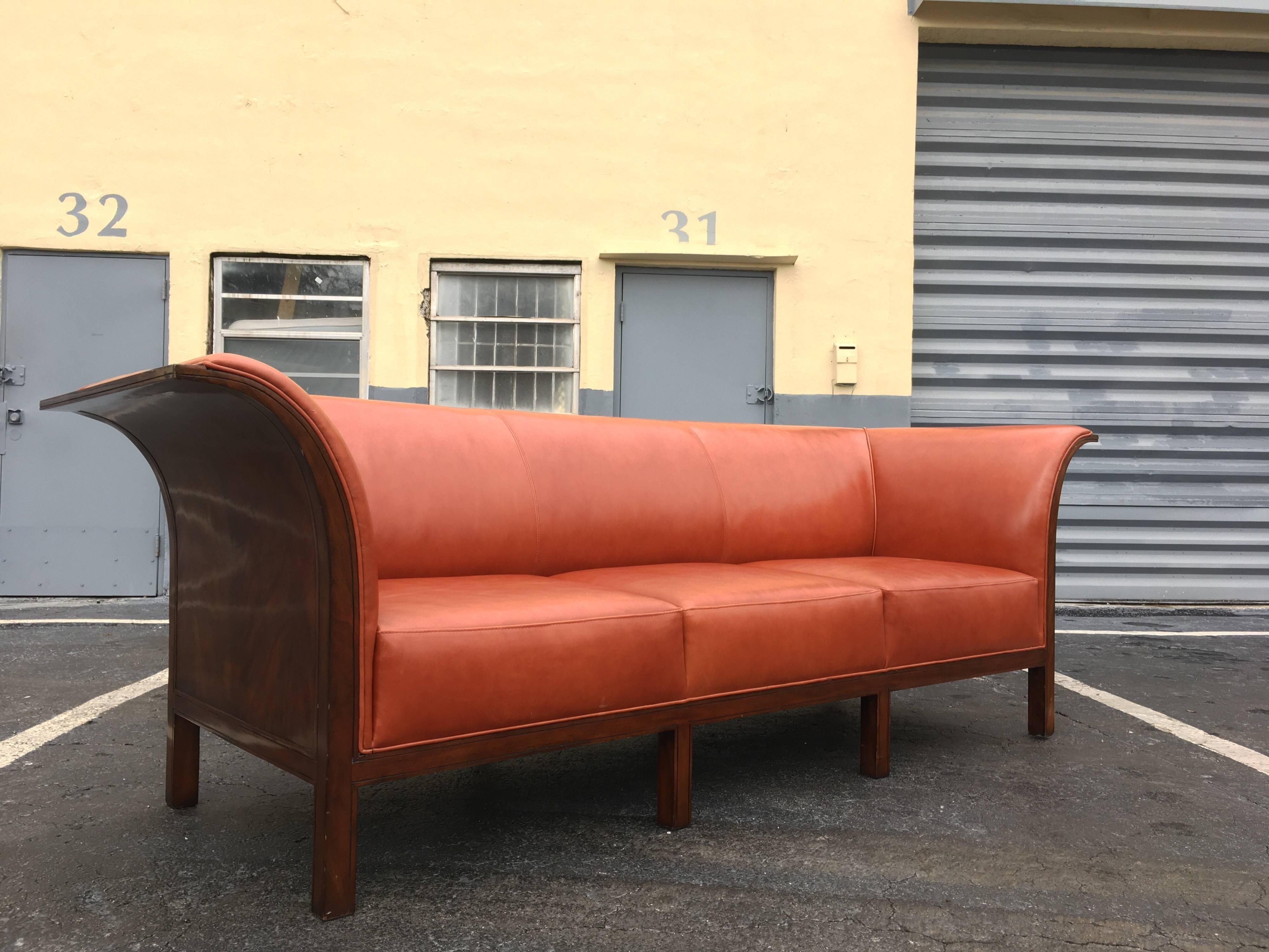 Beautiful leather and mahogany sofa in the style of Frits Henningsen.