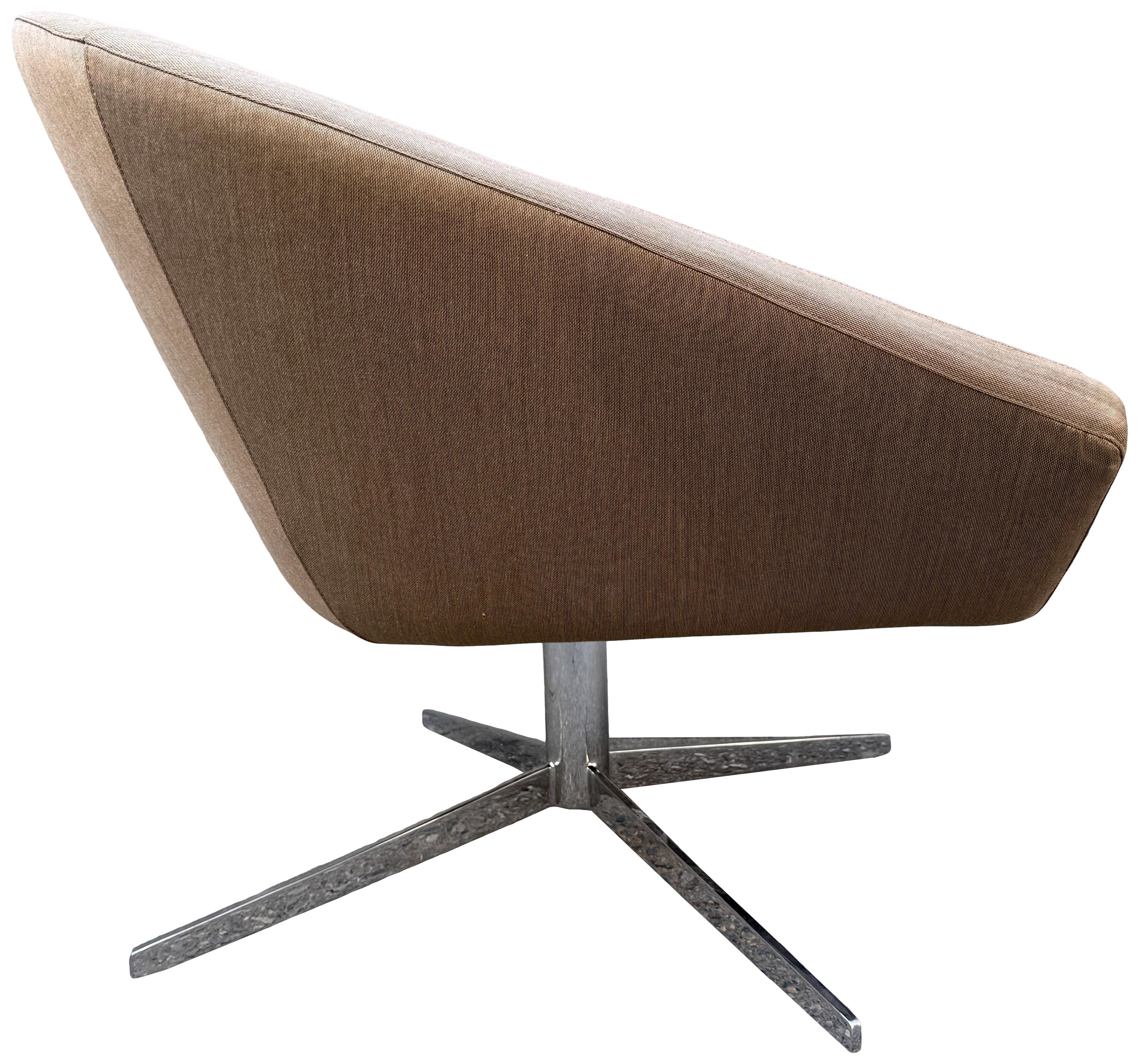 Jeffrey Bernett designed Remy swivel lounge chair with light brown soft silky upholstery on a self returning chrome bases. Heavy, solid, and well made chairs showing little use. Manufactured by Bernhardt in the USA.