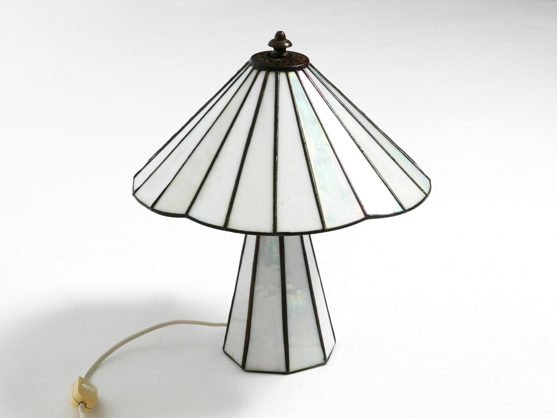 Beautiful little 1970s Tiffany design table lamp for the living room or as a bedside lamp.
Entire lamp is made of fine metal and mother-of-pearl glass.
The mother-of-pearl glass shimmers in different colors when the light is off.
No damage to the