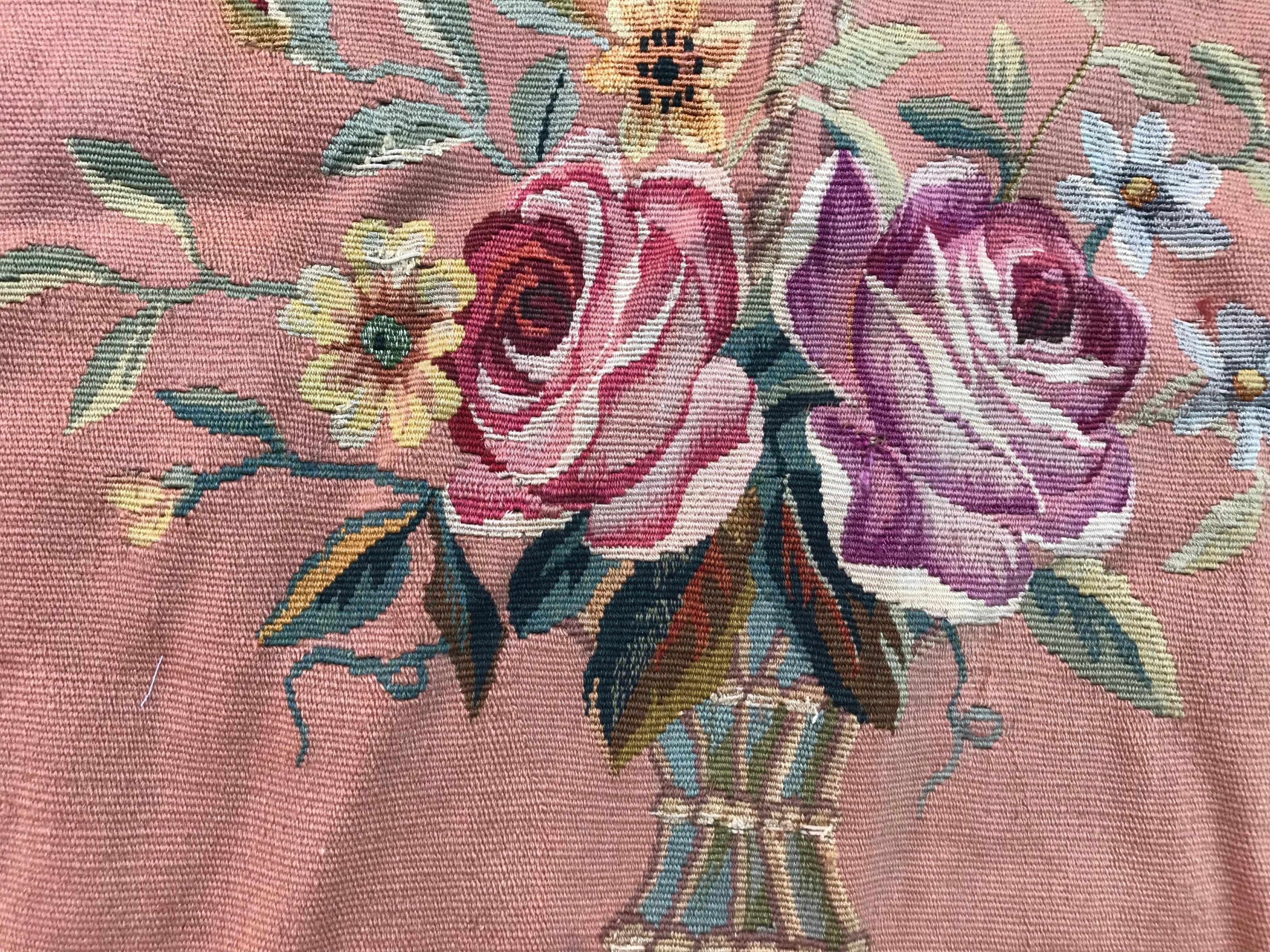 Exquisite late 19th-century Aubusson tapestry/rug from the Napoleon III period. Featuring a stunning floral design in vibrant colors, including a pink-orange field, and accents of pink, green, blue, and yellow. Meticulously handwoven with a blend of