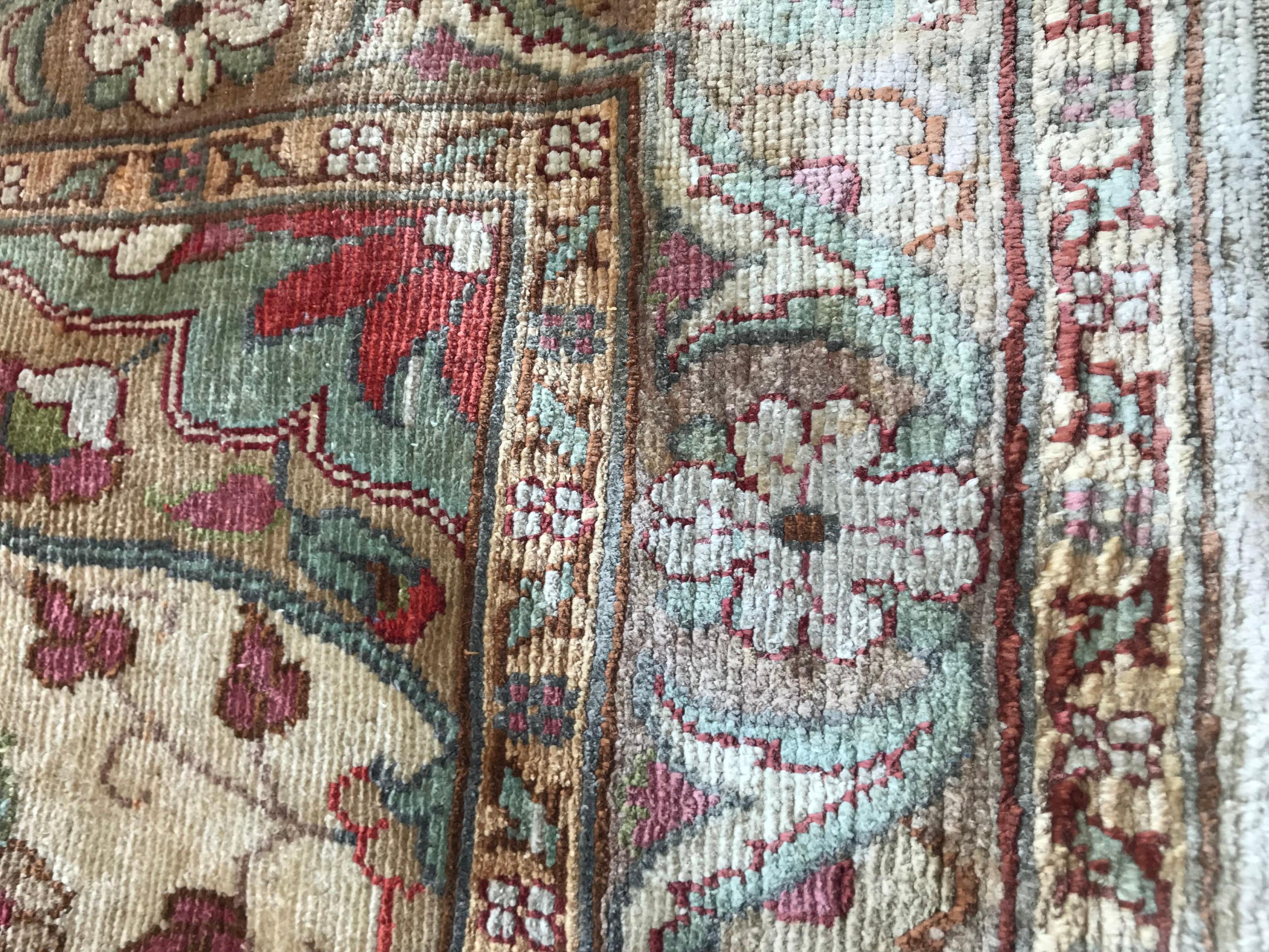 Nice little Turkish rug with beautiful design and light colors, entirely and finely hand knotted with silk velvet on silk foundation.

   