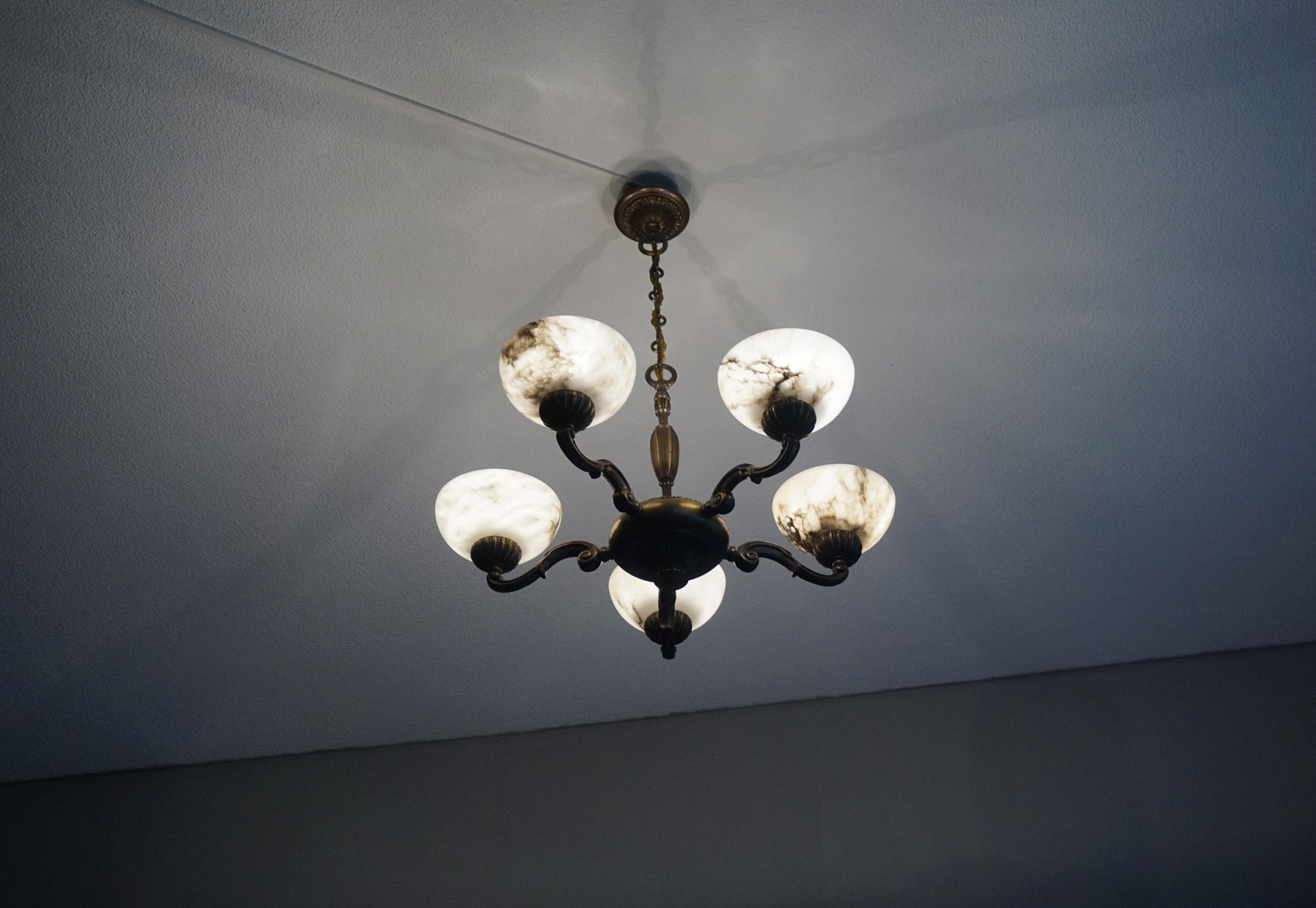 Small size and great looking brass and alabaster chandelier.

This here small size chandelier is another one of our recent great finds. If you are looking for a modest size alabaster light fixture, but you do want it to radiate more light than your