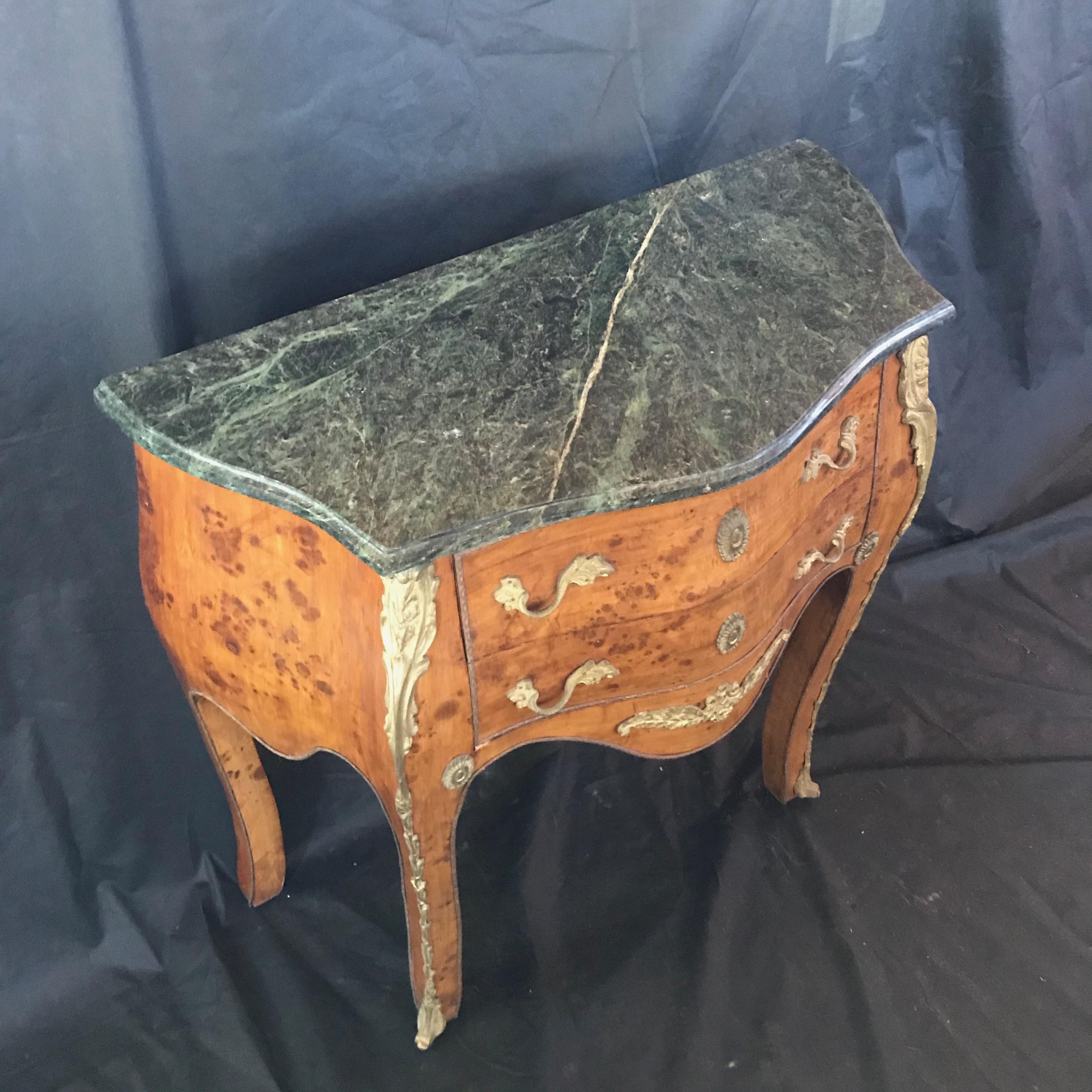 Beautiful Louis XV burled walnut petite commode, nightstand or side table having dark green marble top and original bronze pulls and scrollwork. #4361.

 