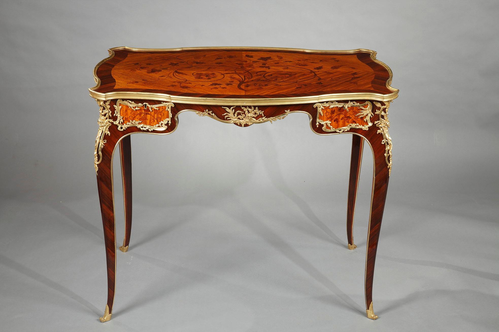 Charming veneered wood and gilded bronze Louis XV style table attributed to J.E. Zwiener, with an elegant 