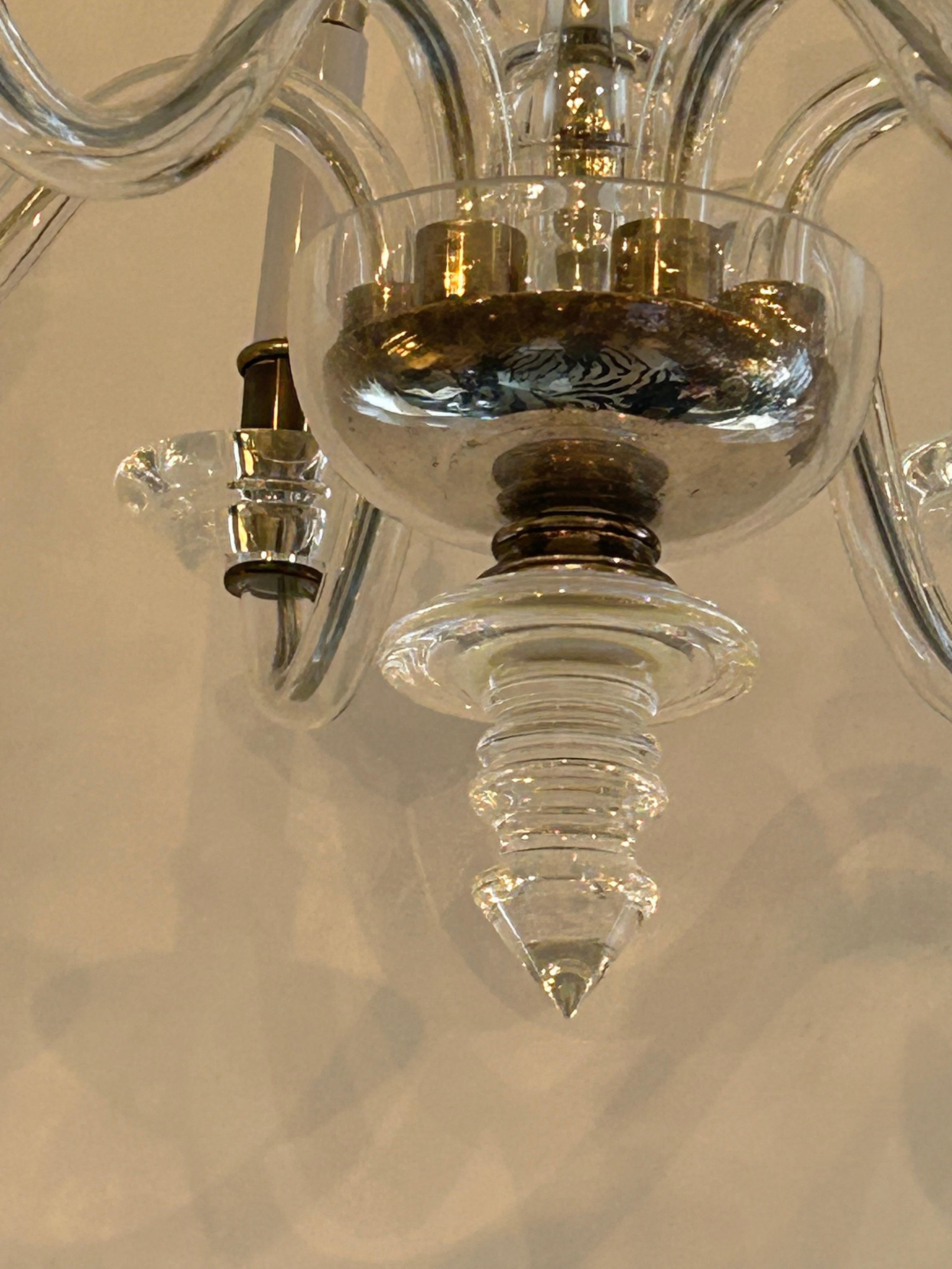 Stunning classic and contemporary chandelier made of lucite and glass having 6 arms.