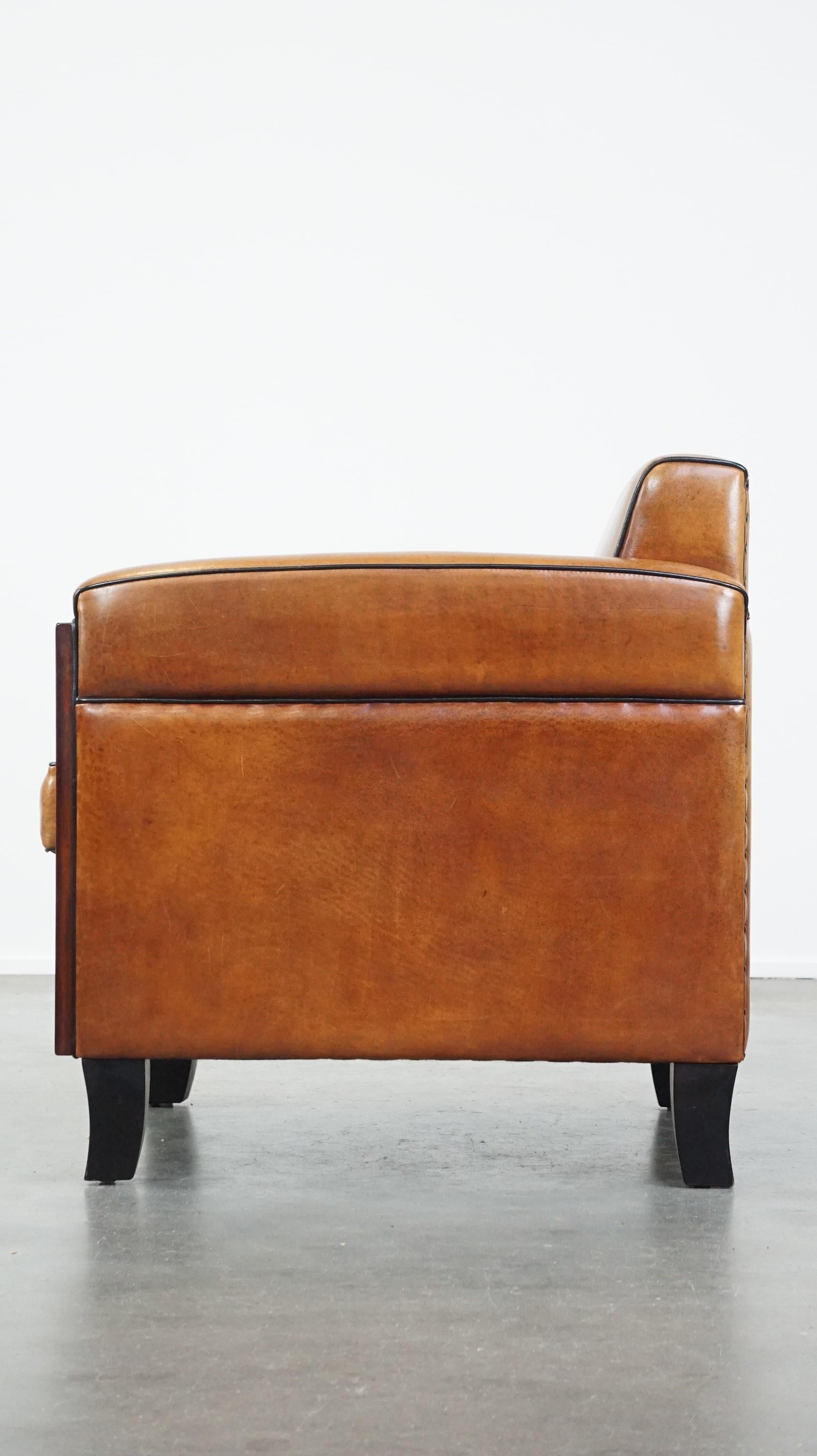 20th Century Beautiful, luxurious sheepskin armchair in Art Deco style with wooden details