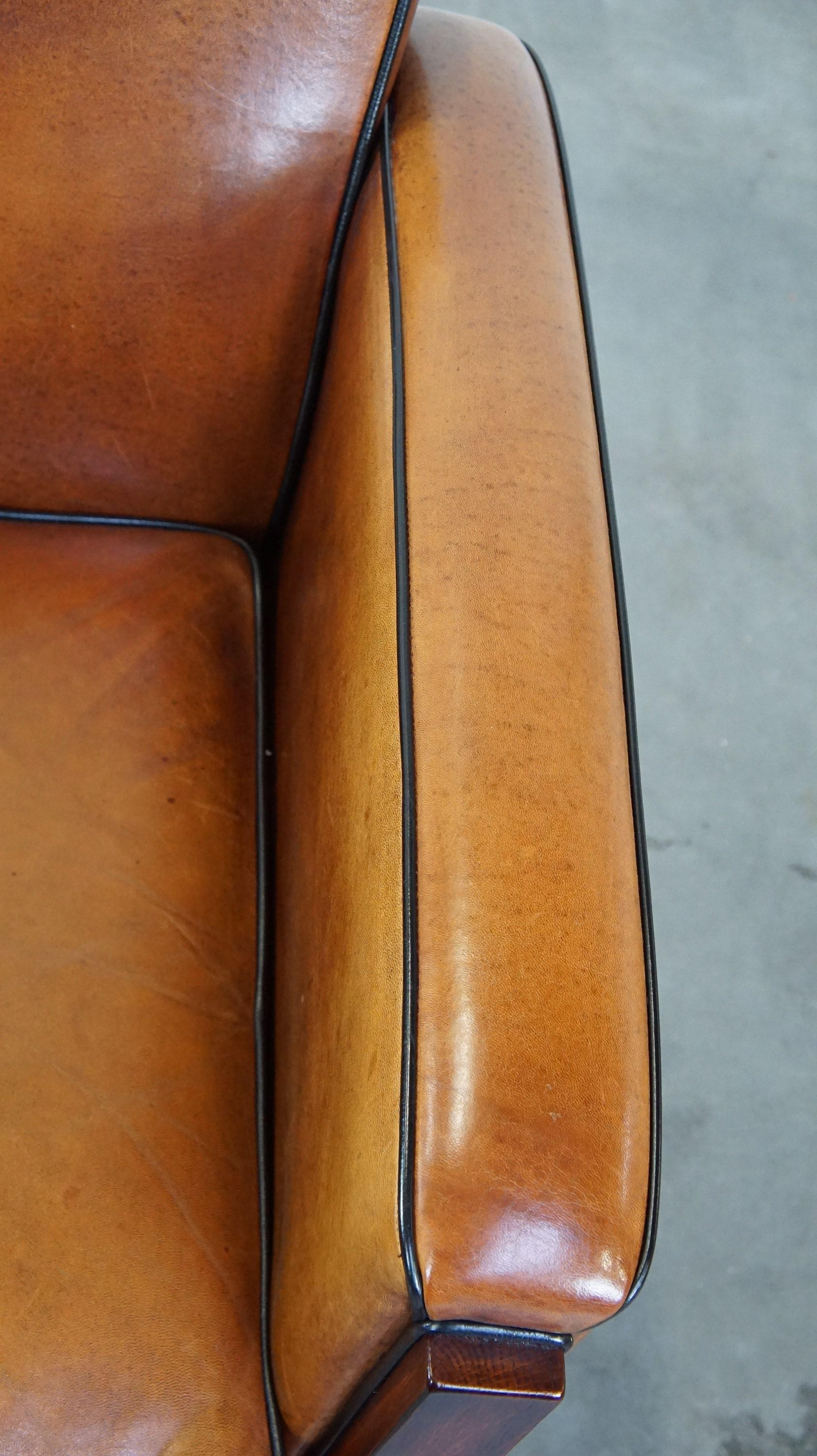 Beautiful, luxurious sheepskin armchair in Art Deco style with wooden details 2