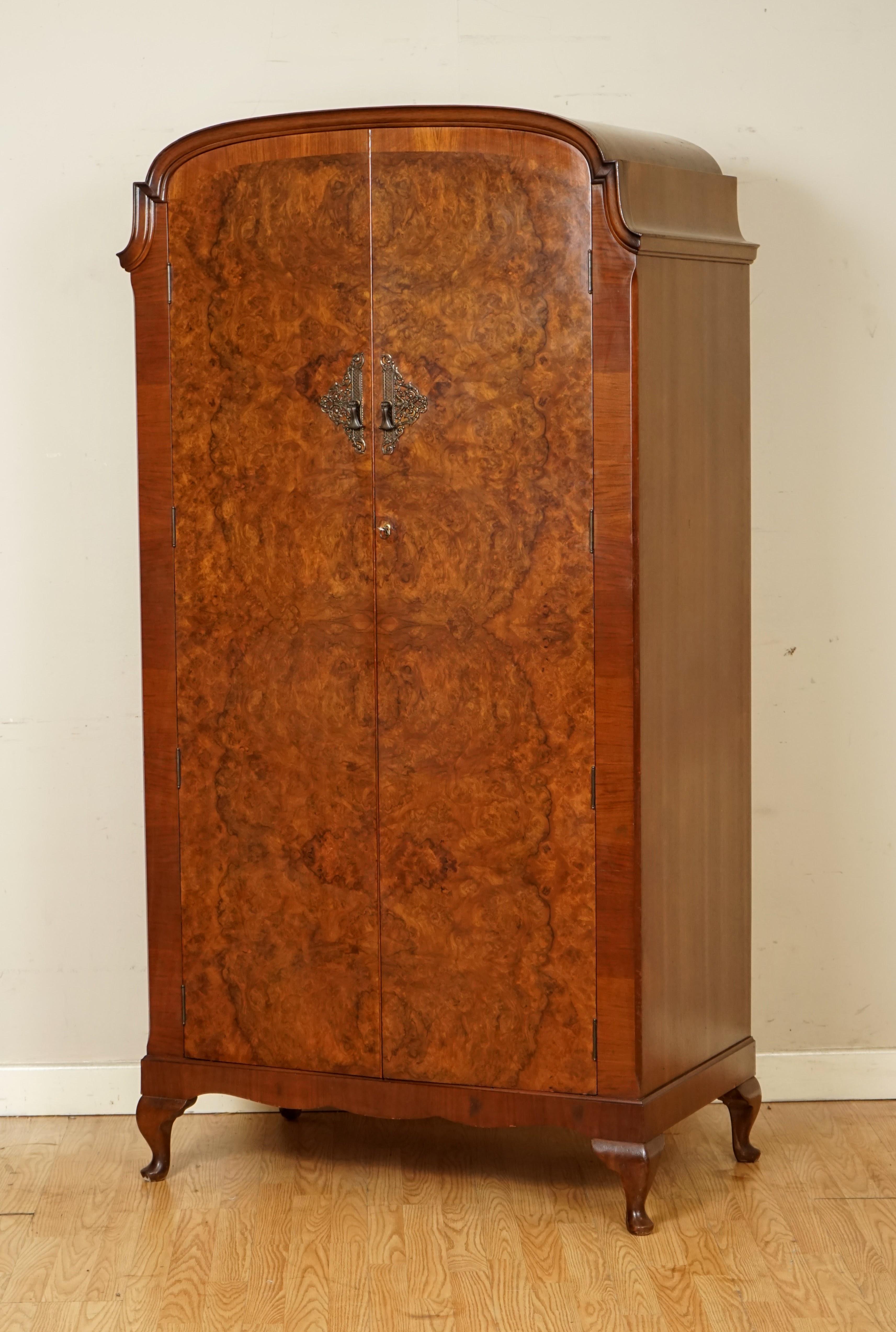 We are so excited to present to you this Art Deco burr walnut double wardrobe.

A very lovely solid and well made wardrobe, there is a damage on side of the wardrobe which has three lines across, apart from that, the rest of the wardrobe is in a