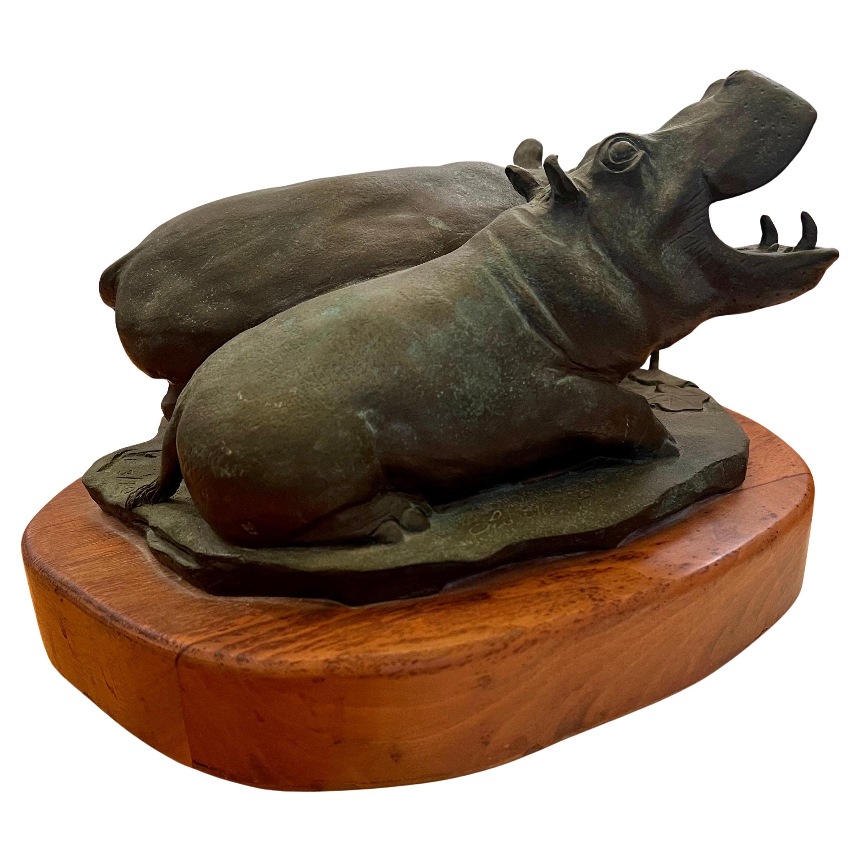 Beautiful massive solid bronze realistic sculpture sitting on solid wood base Signed by Lou Ellain Pinas 3/20, rare and beautiful piece.