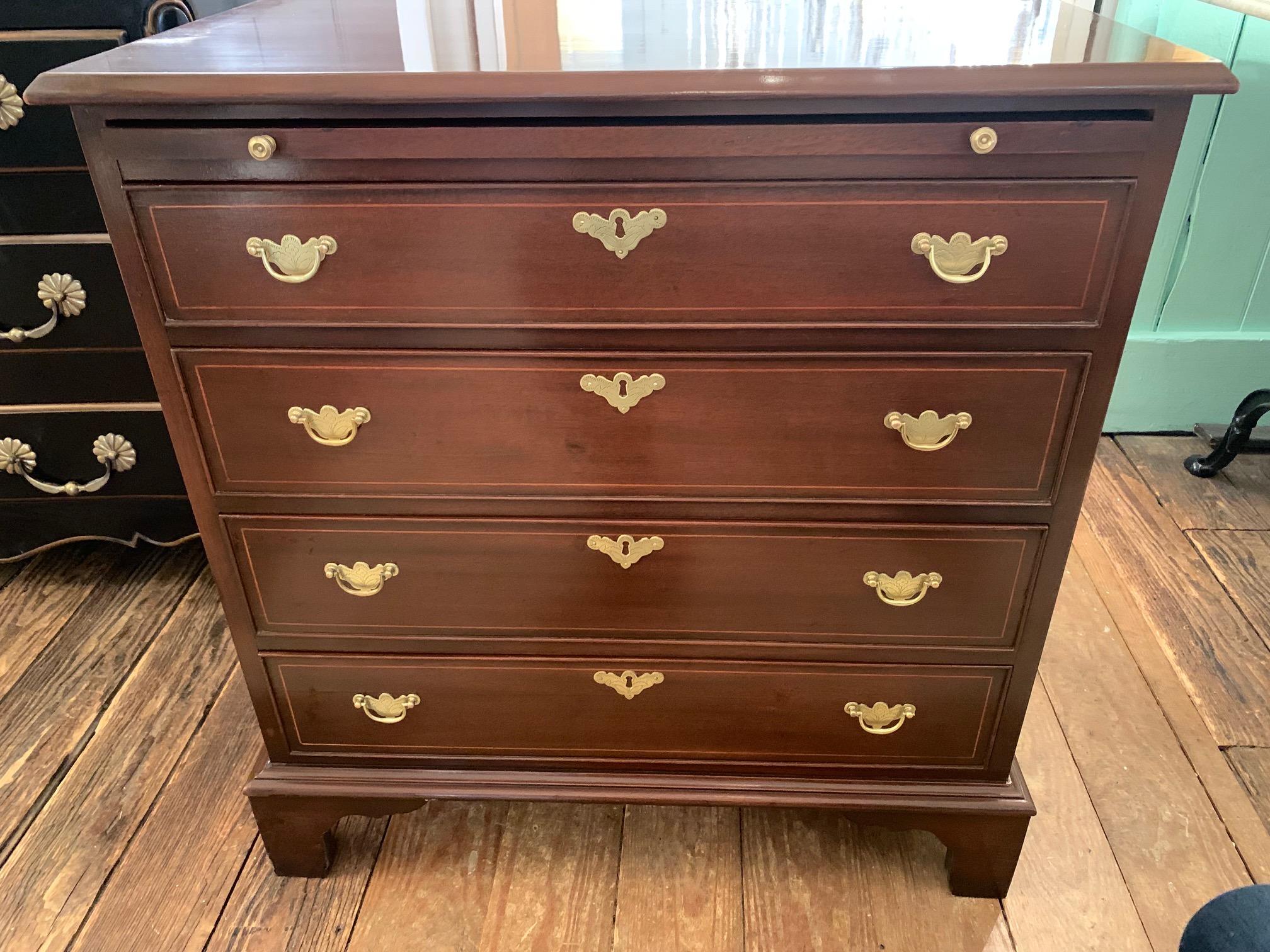 Beautiful small Chippendale style mahogany chest of drawers having 4 drawers and slider. Original brasses and newly refreshed.