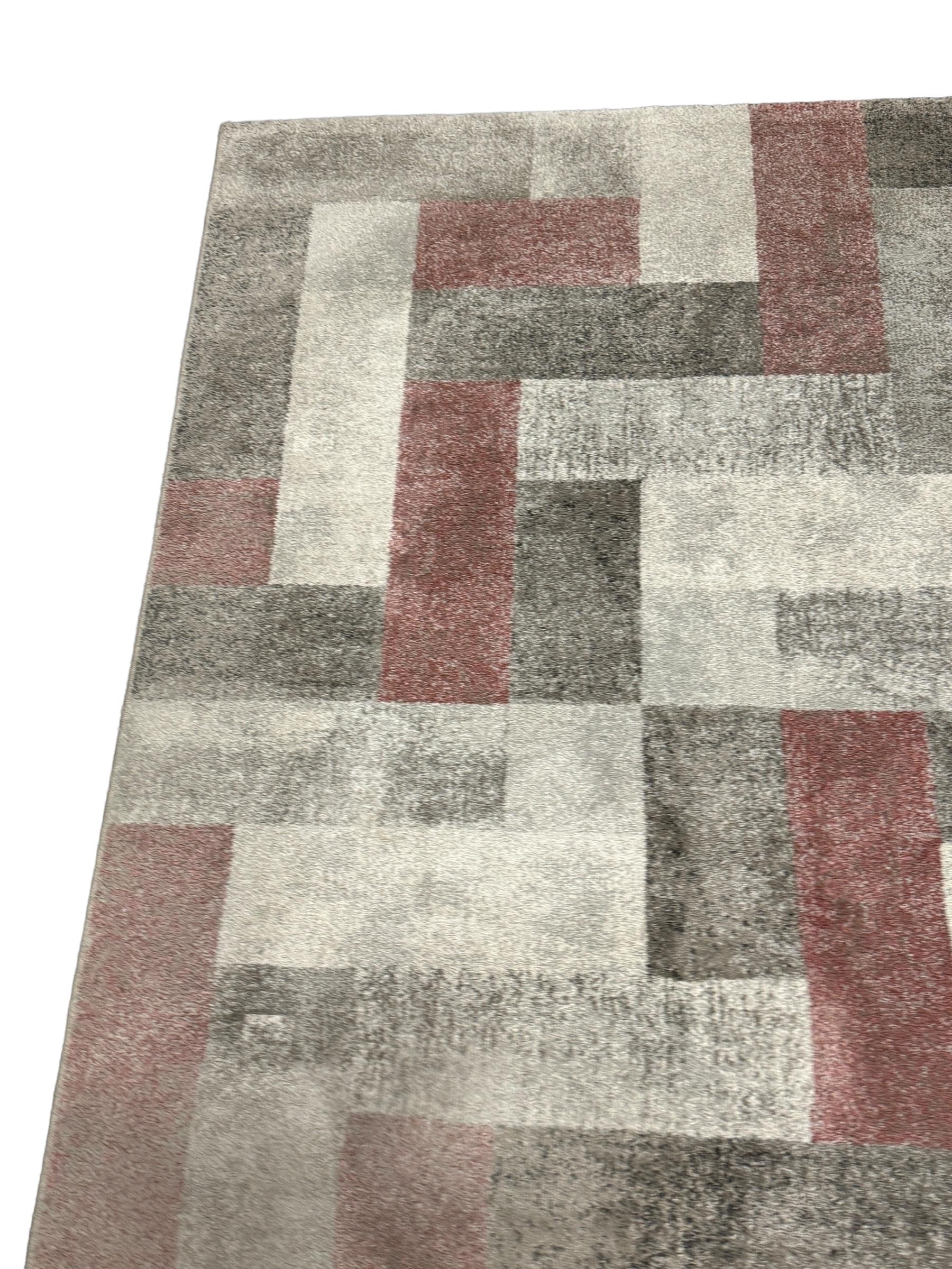This rug is a great example of 1980s modern interior. Made in high quality weaving technique. This high quality high pile rug was designed in the 1980s and manufactured in Belgium. It is made from wool and it is still in a good vintage condition.