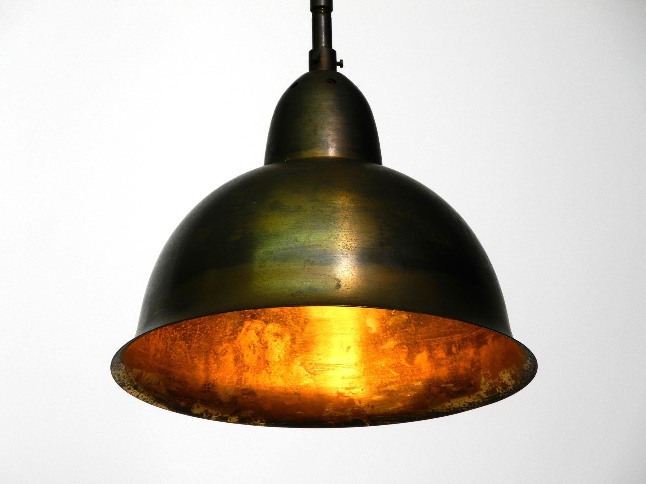 Beautiful original mid century brass pendant lamp.
This lamp hung in a German church for over half a century. Brass shade and socket.
100% original and fully functional.
One E27 socket for up to 60W.
Rewired due to age and with a new metal