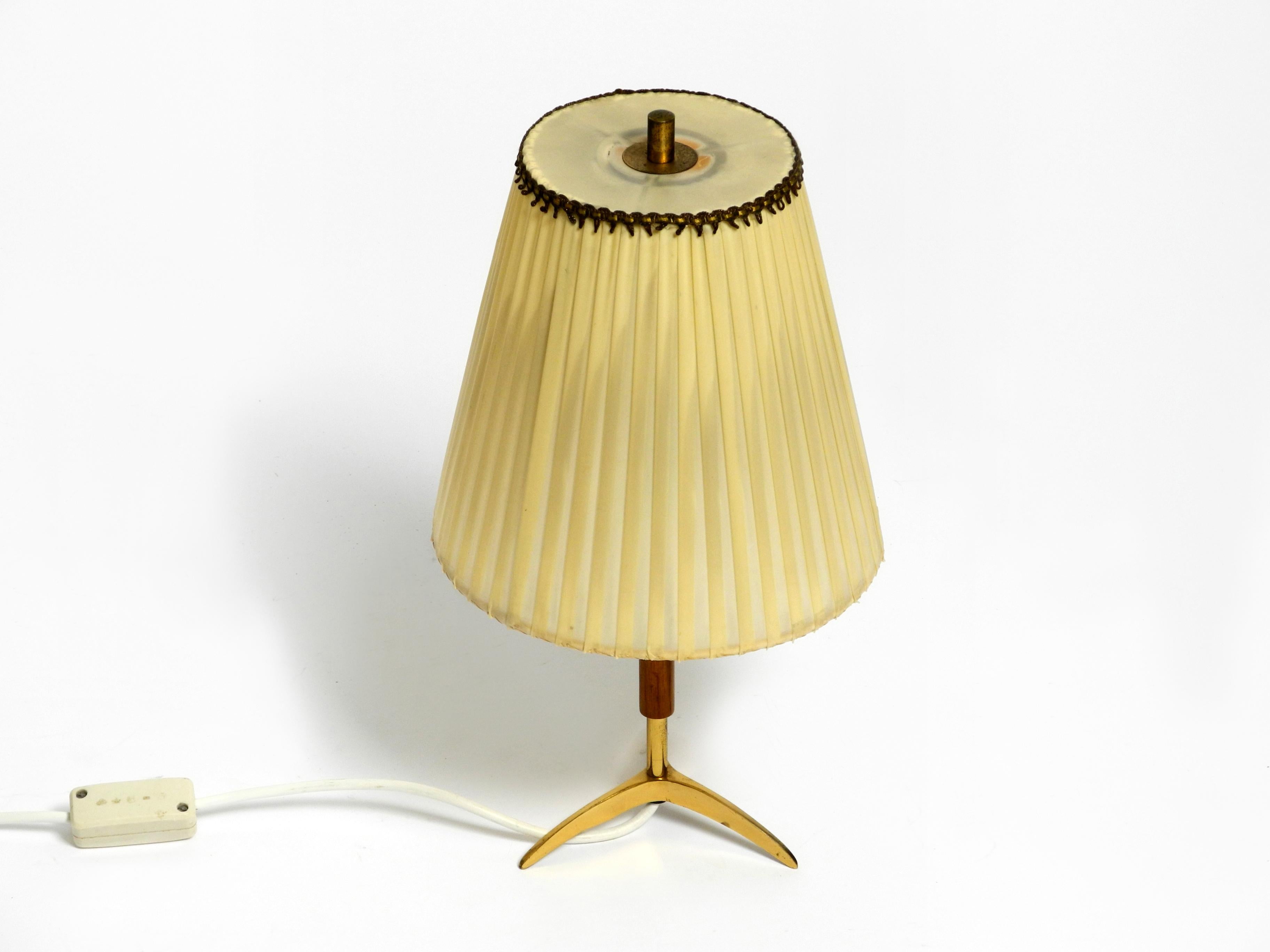 Austrian Beautiful mid century brass star base table lamp from Kalmar with original shade For Sale
