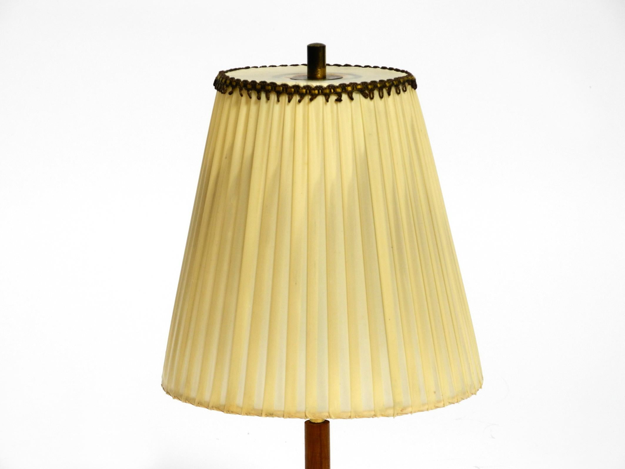 Brass Beautiful mid century brass star base table lamp from Kalmar with original shade For Sale