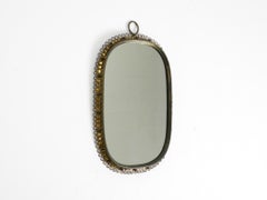 Beautiful mid-century brass wall mirror by Josef Frank for Svenskt Tenn Sweden