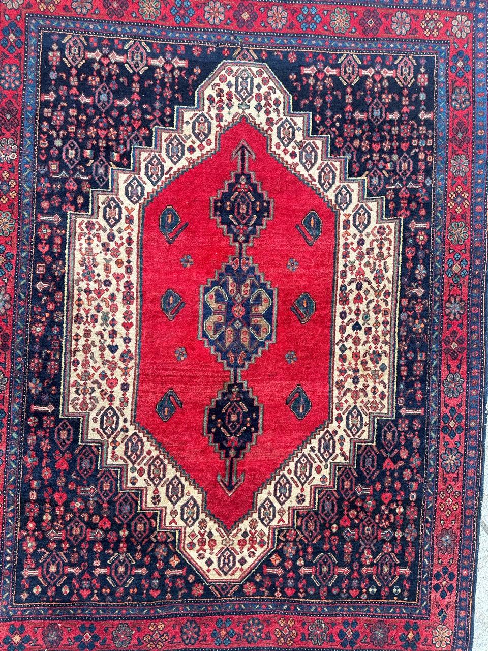 Nice vintage Bijar rug with beautiful design and nice natural colours with navy blue field, white, red, blue, green, orange, yellow and brown, entirely and finely hand knotted with wool velvet on cotton foundation.
Very Small wears due to the age