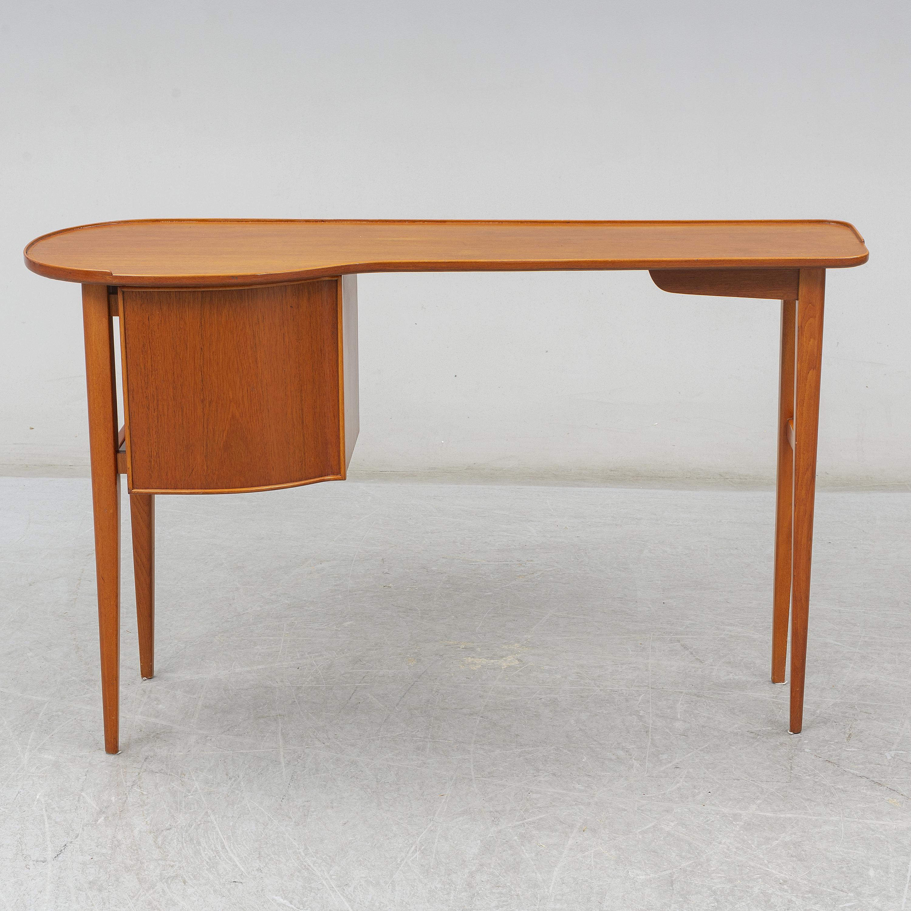 Mid-20th century wooded sideboard in original finish. Can also be used as a small desk, console, or beautiful vanity table.  In the style of Joseph Frank. 
(depth starts at 11.4 and increases to 16.13