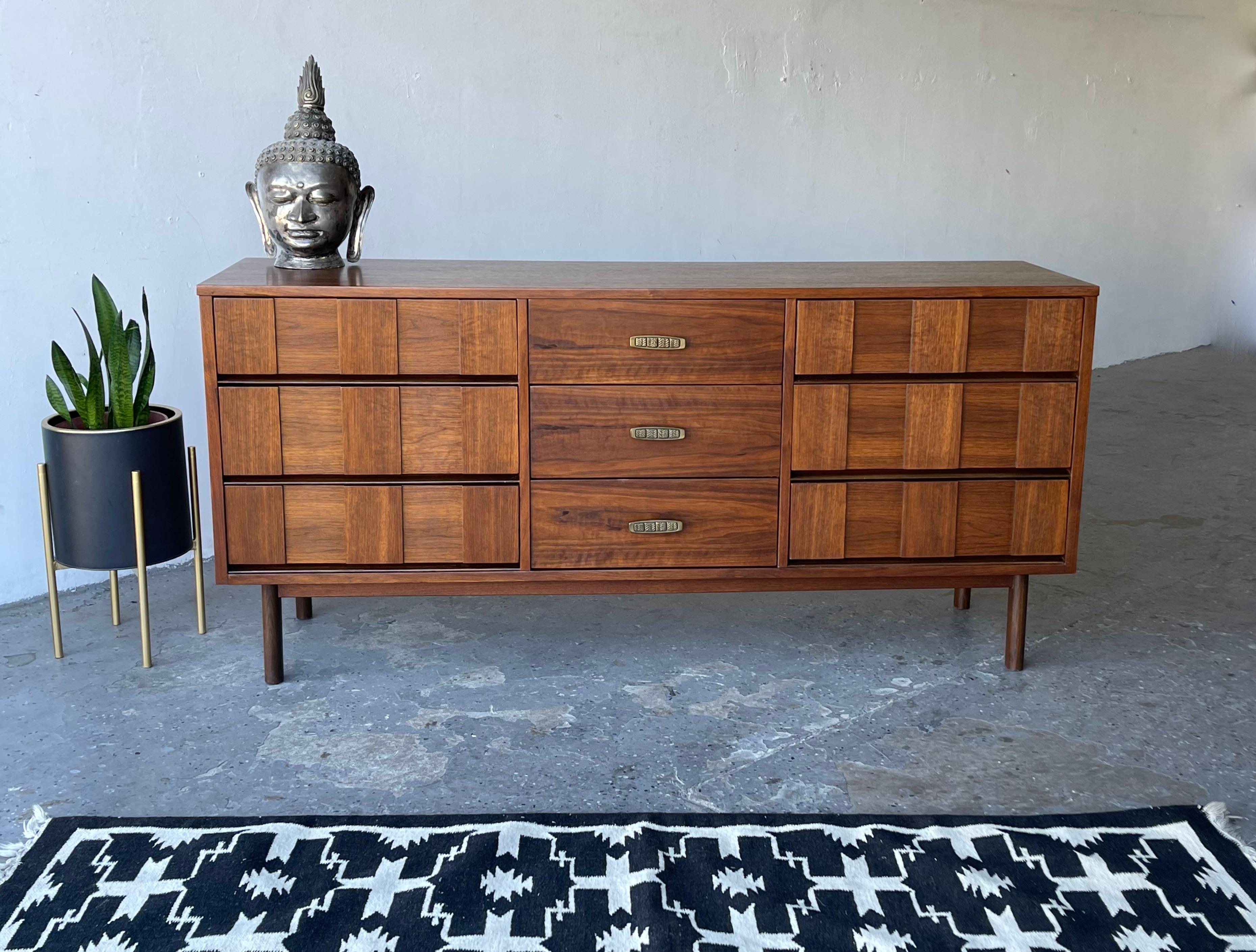 Beautiful Mid-Century Modern Bassett furniture low-boy dresser

64” wide 18” deep 30” high

Professionally refinished and restored

 Last Picture shows matching high boy dresser listed separately.