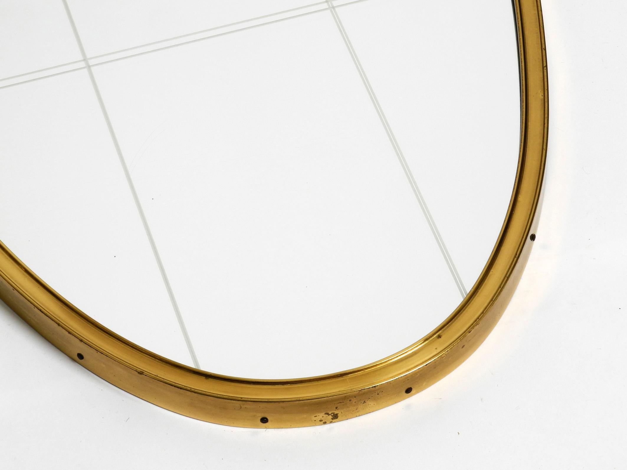 Brass Beautiful Mid Century Modern brass wall mirror by Munich Zierspiegel