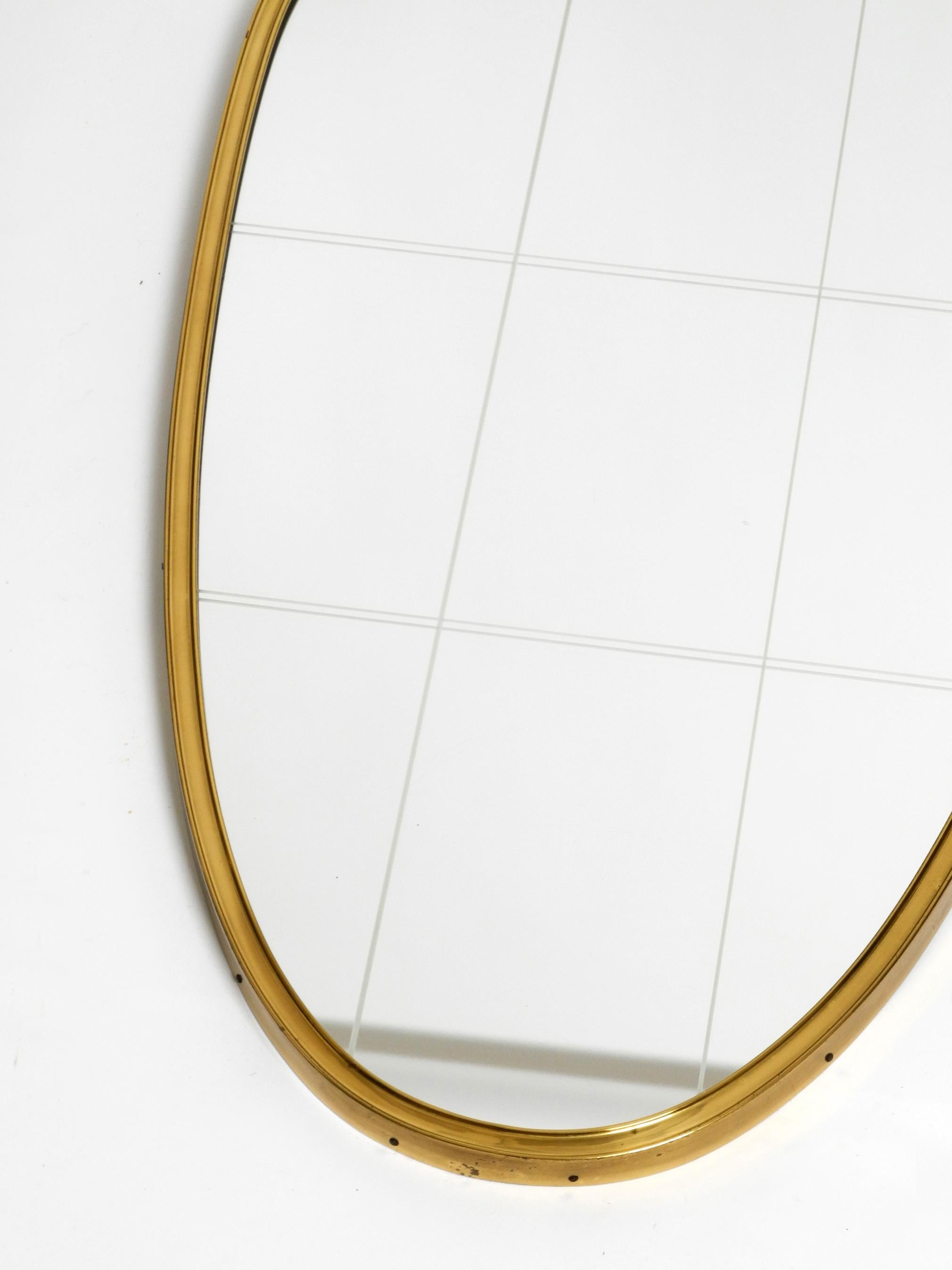 Beautiful Mid Century Modern brass wall mirror by Munich Zierspiegel 1