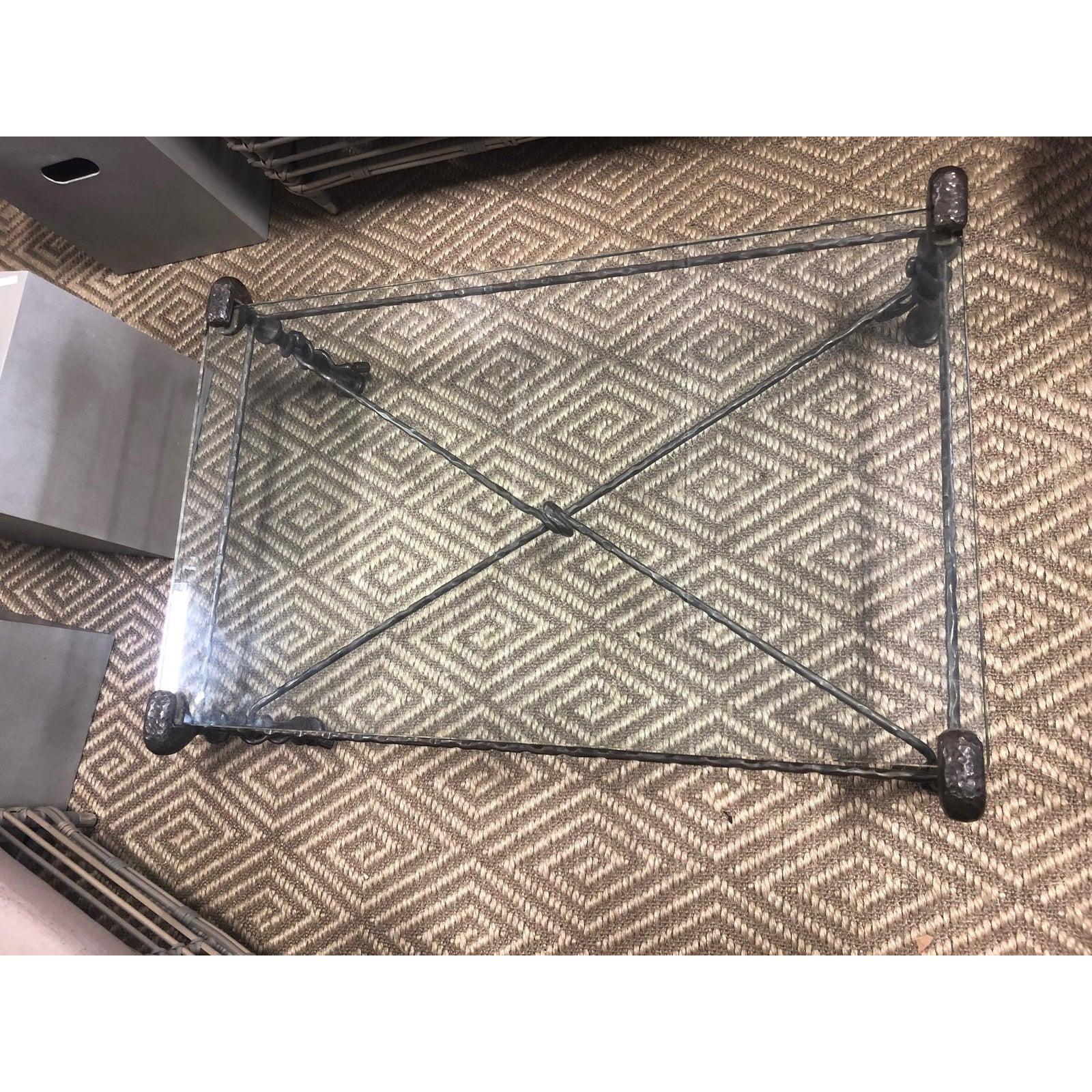Beautiful glass top Giacometti style coffee table with criss cross hammered iron base, thick rectangular glass, and both a rustic quality and a refined sense of scale and design that makes this a very versatile piece.
