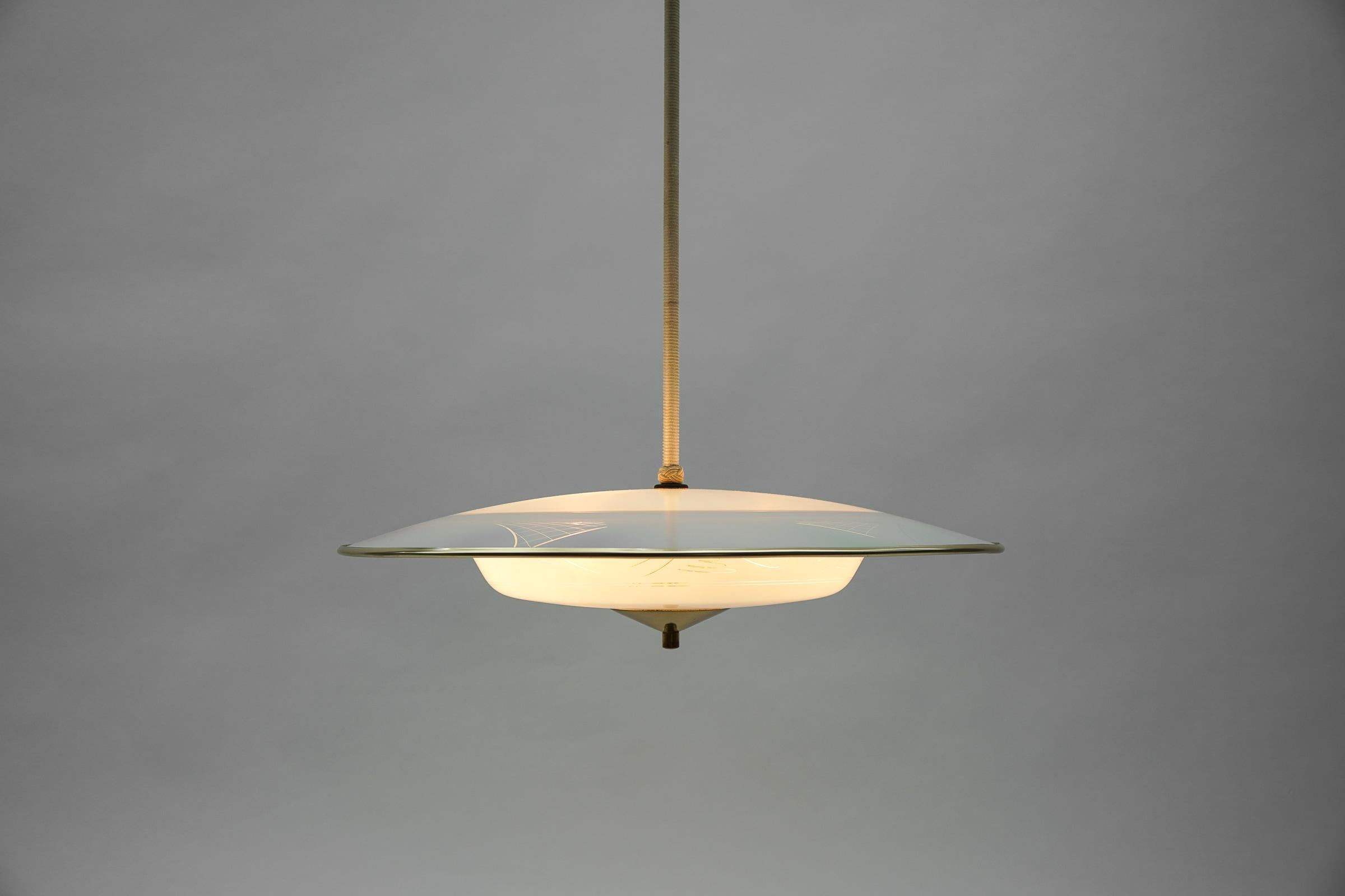 Italian Beautiful Mid-Century Modern hanging lamp in glass and brass, 1950s For Sale