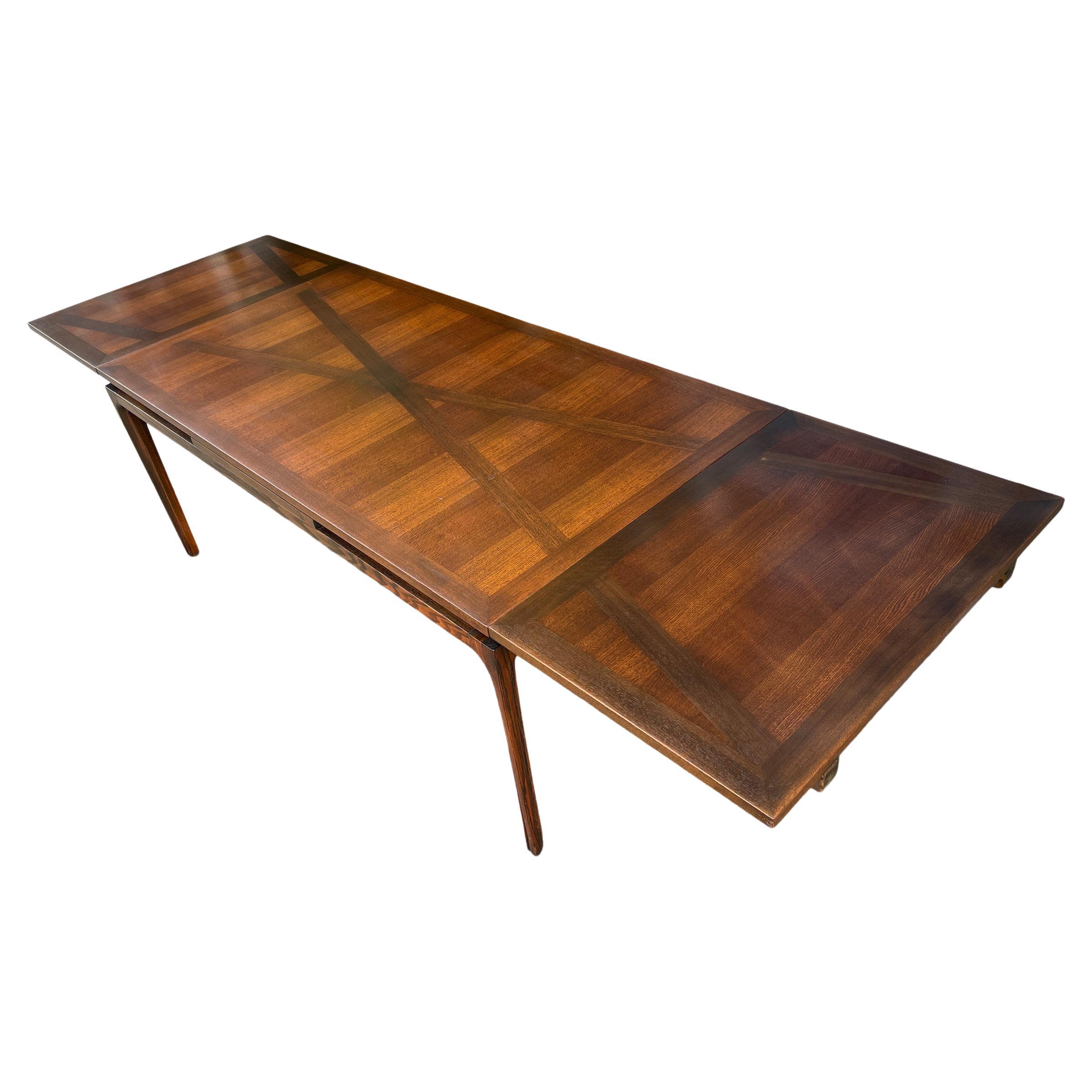 Beautiful Mid-Century Modern Romweber Jasper oak extension dining room table. Beautiful Solid Oak Dining table with pull out leaves on each side in great vintage condition. Has X veneer inlay throughout table and leaves. Very sold and sturdy. Table