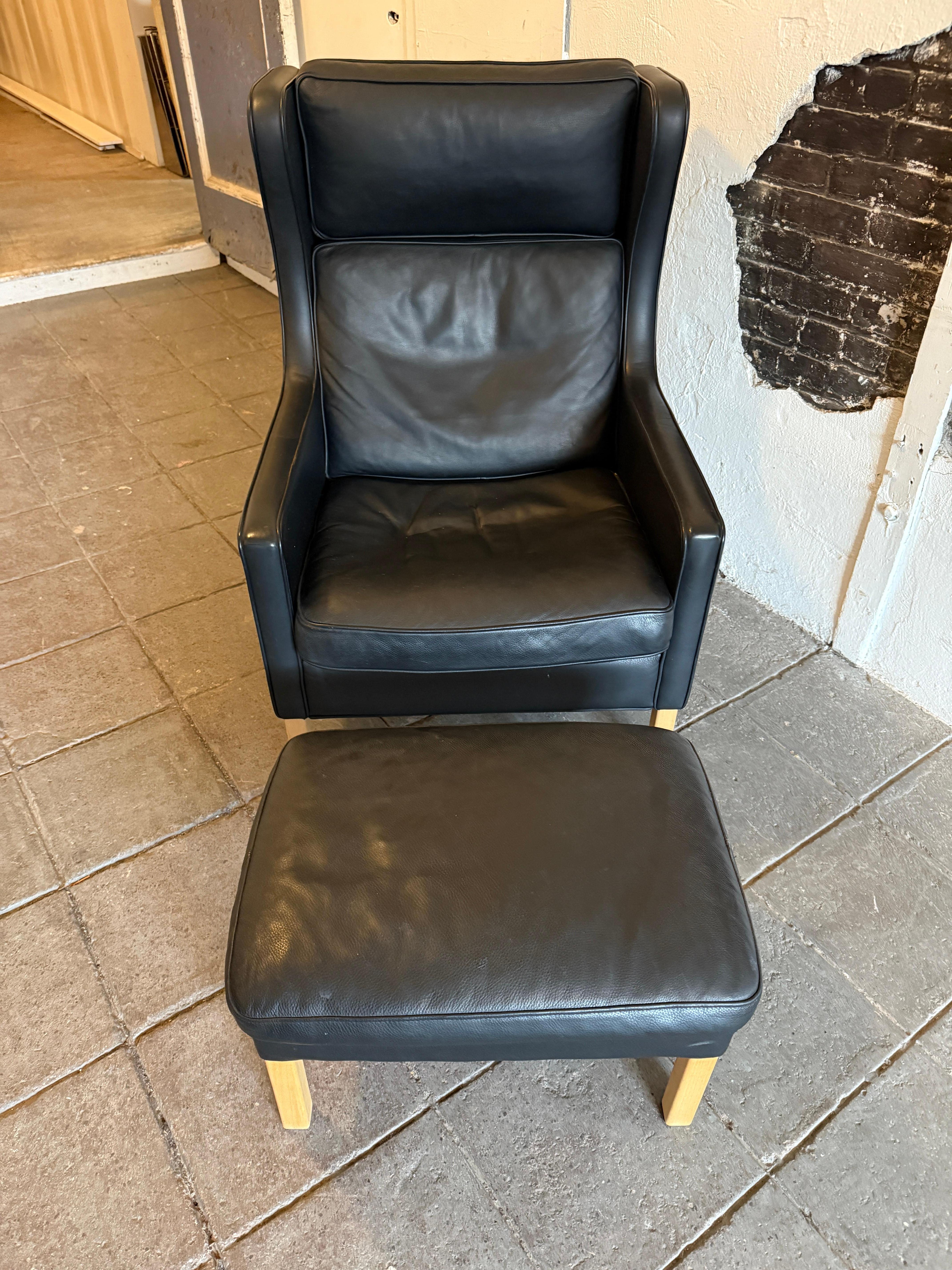 Danish Beautiful Mid Century Scandinavian modern Black Leather Wingback Chair Ottoman For Sale