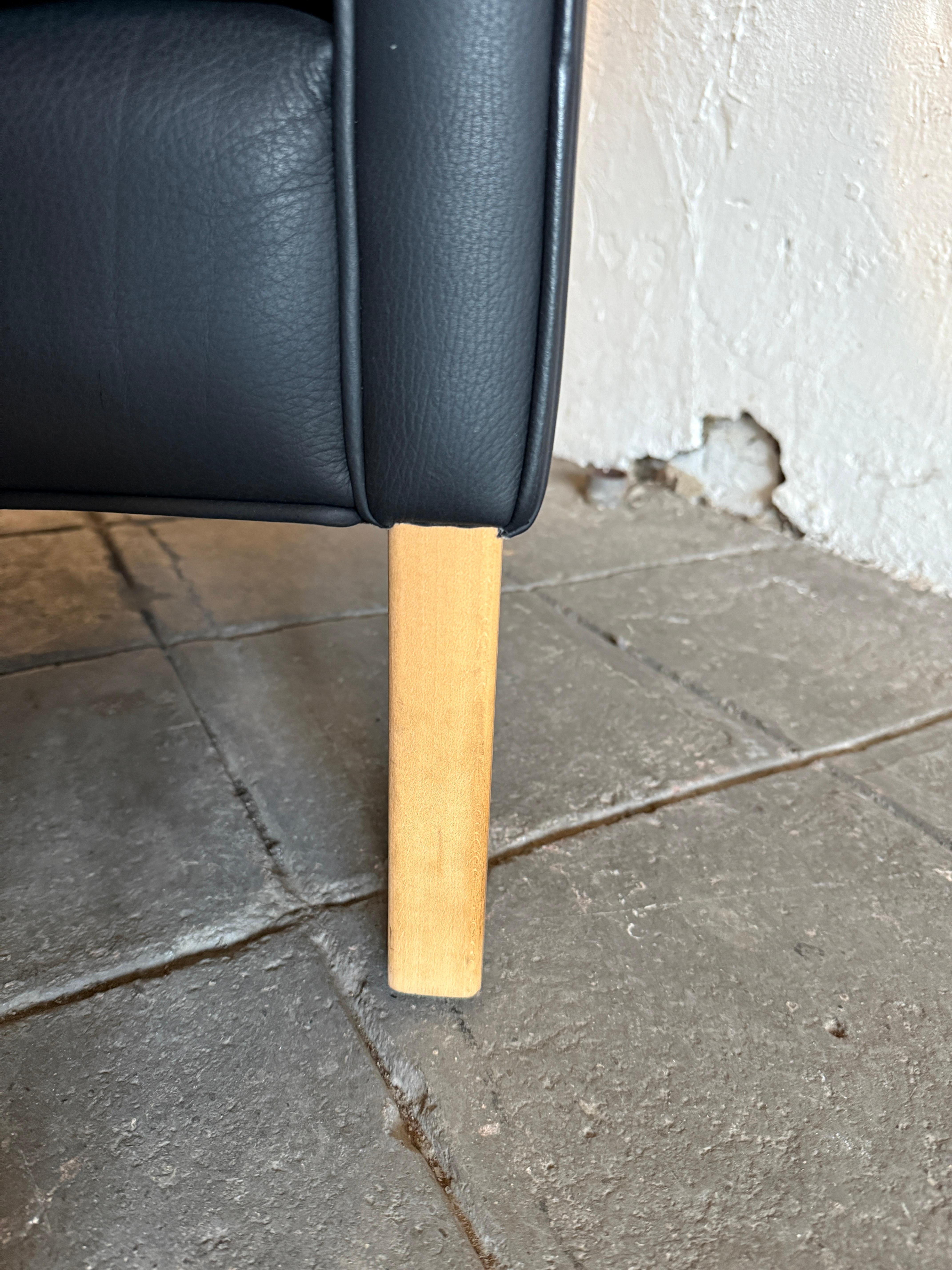 Beautiful Mid Century Scandinavian modern Black Leather Wingback Chair Ottoman For Sale 1