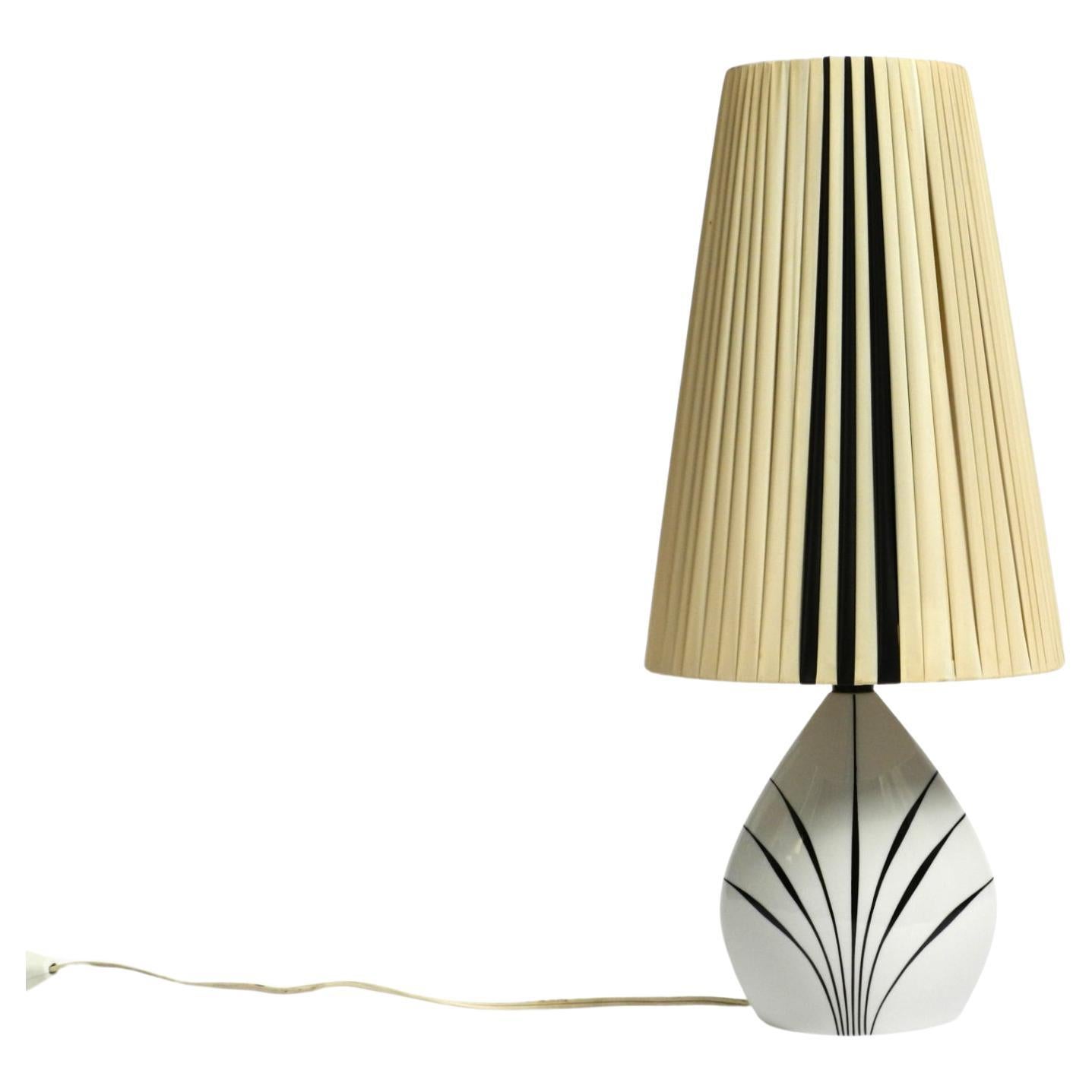 Beautiful mid-century table lamp made of ceramic and plastic shade by Alka Kunst