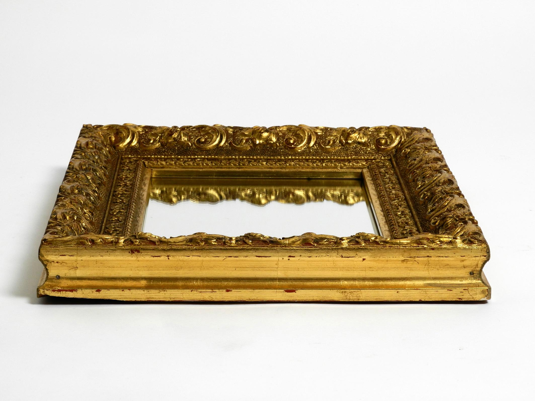 Mid-Century Modern Beautiful Mid Century Wall Mirror from Italy with an Ornate, Gold-Plated Frame For Sale