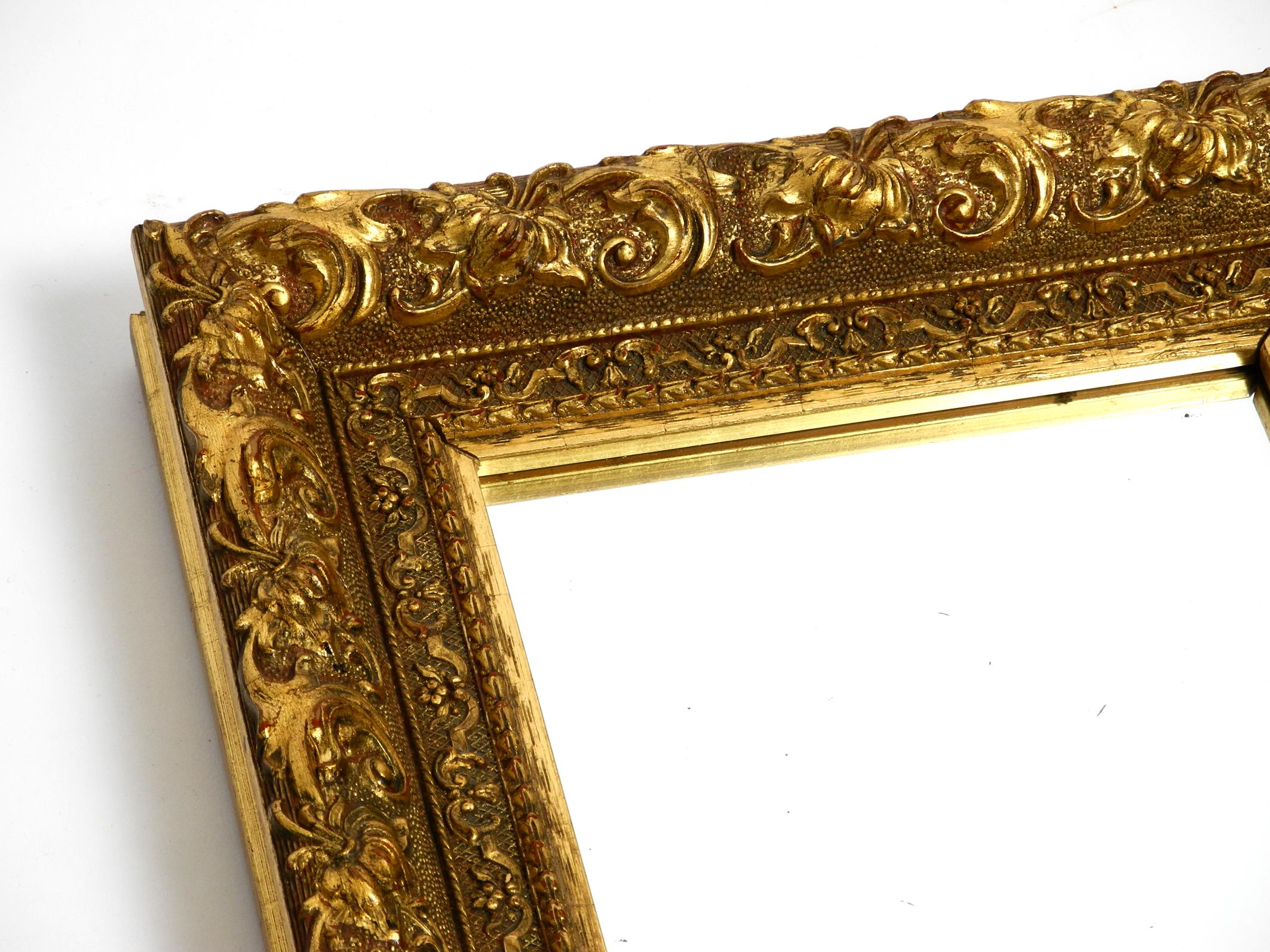 Beautiful Mid Century Wall Mirror from Italy with an Ornate, Gold-Plated Frame For Sale 1